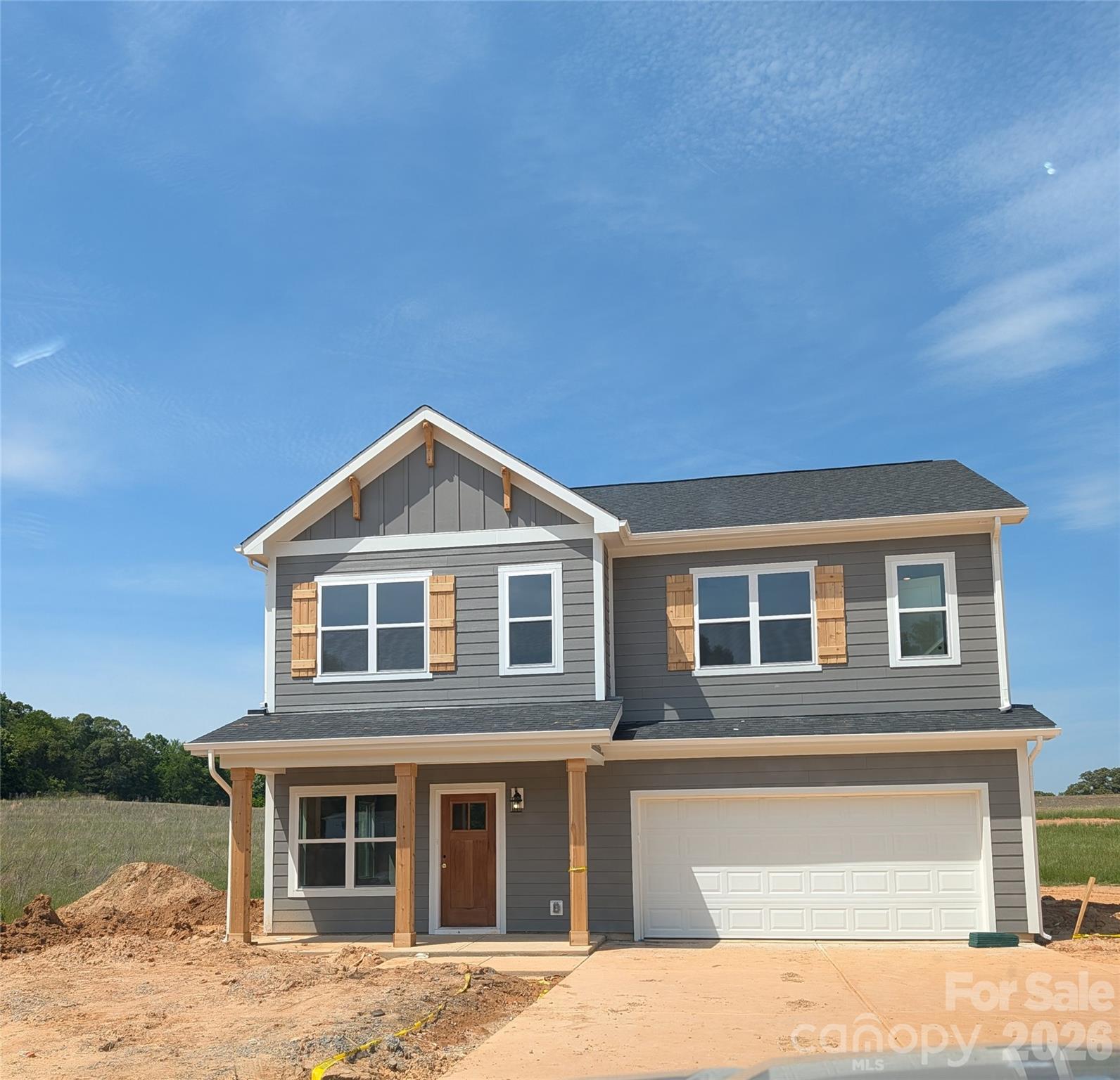 This nearly completed new construction offers a beautiful home with an inviting kitchen that features a large island and a pantry. The open layout combines the living, dining, and kitchen areas, creating a spacious feel. The main level also includes a half bath, an office, and a large sunroom. Additional features of the home include a covered porch and a two-car garage.

On the upper level, you will find four bedrooms and two full baths. There is an extra bonus room that could serve as an additional office, playroom, or sitting area. For added convenience, the laundry room is located on the upper level. This home will be completed soon, and professional photos will be available shortly.