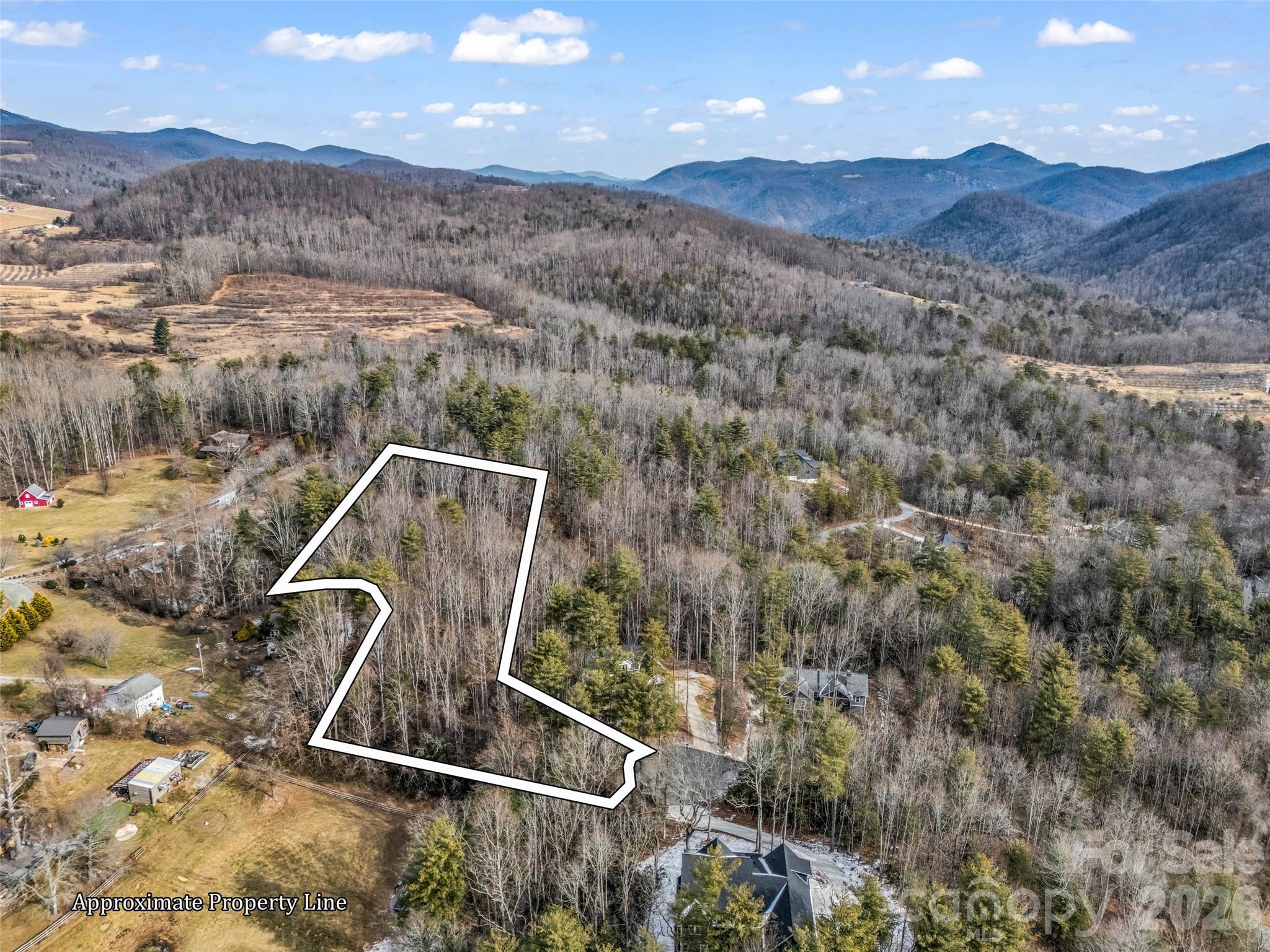 Build your dream home on this large, wooded home site in a country setting that provides privacy and convenience too! The beautiful community of Old Orchard is peaceful and tranquil and offers residents private access to a pool, clubhouse, creek and picnic areas. Easily accessible from Hendersonville, Lake Lure and Chimney Rock, and just minutes to I-26. 4 Bedroom Septic Permit on file from 2007. Property is subject to a recorded right of way agreement as evidenced on the seller's survey for the property.