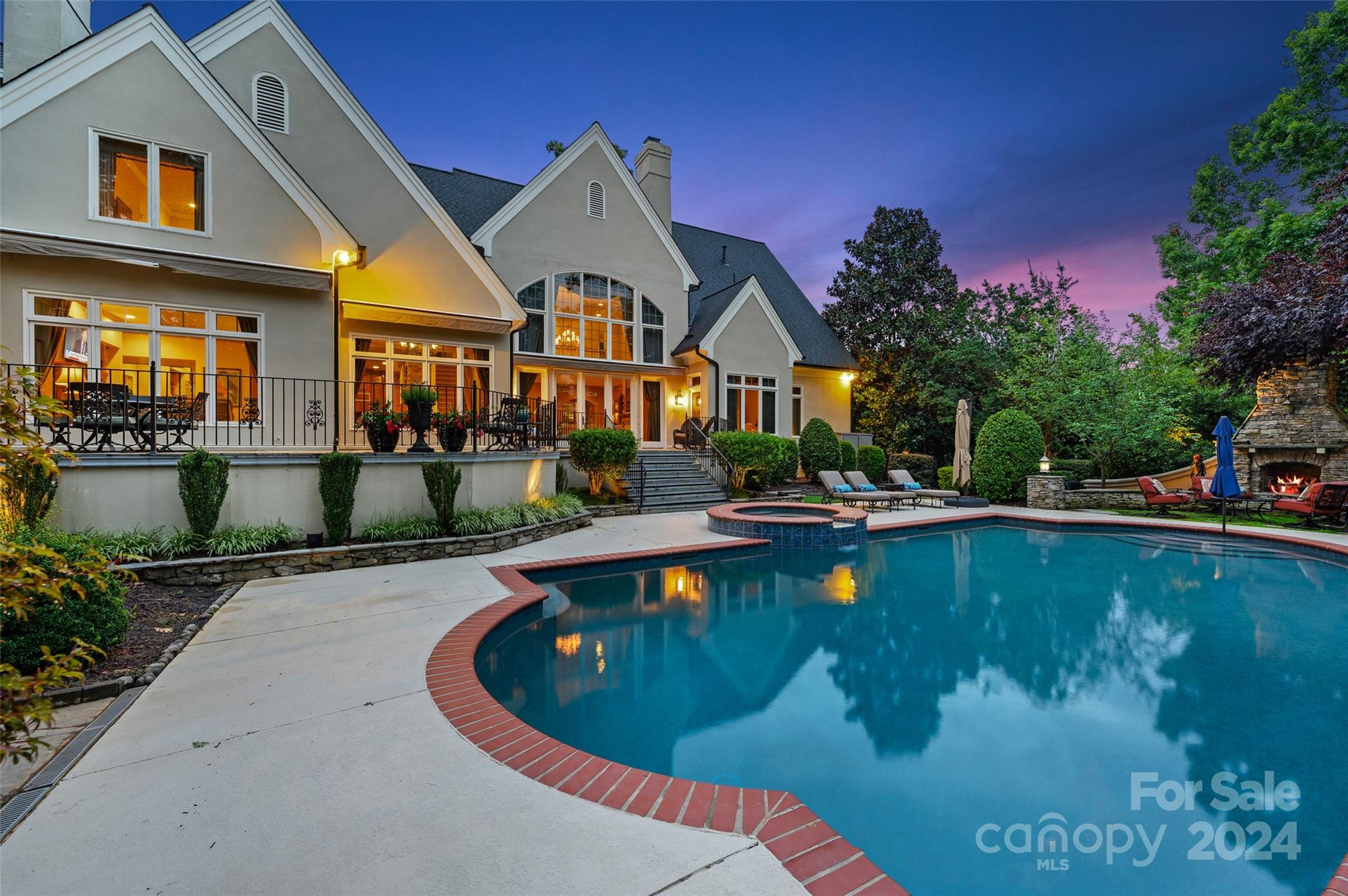 ENJOY VACATION LIVING EVERYDAY!  Amazing Waterfront Custom- Ideal for Entertaining or Quiet Retreat Offers Beautiful Landscaped Grounds with Salt Water Pool, Terrace Spans the rear Complete w/ Outdoor Grilling, Stone Fireplace & Putting Green!  Chef's Kitchen has Commercial SS Viking Appliances, Breakfast Bar, Walk-in Pantry, Butlers Pantry, Wet Bar & Walk-in Wine Cellar.  Bayed Breakfast w/Vaulted Ceiling, Opens to Expansive Keeping Room. Elegant Vaulted Formal Dining & Dramatic 2 Story Great Room w/FP & Built ins.  Primary on Main w/2 Custom WICs & Marble Bath PLUS Private Library/Office. "Hard to Find" AMAZING  In-Law Suite w/Private Entry on Main. Enjoy Serenity of  Sunroom which brings the Outdoors in. Upper Level Offers-4 En-Suite Bedrooms PLUS Theatre, Bonus, Game Room & Bar. This Timeless Classic is Convenient to McAlpine Greenway, Trader Joes, Piper Glen & Stonecrest Shops & Restaurants & I485.  Enjoy Enchanting Sunsets from 100 ft of Shoreline-Breathtaking!
Welcome Home!