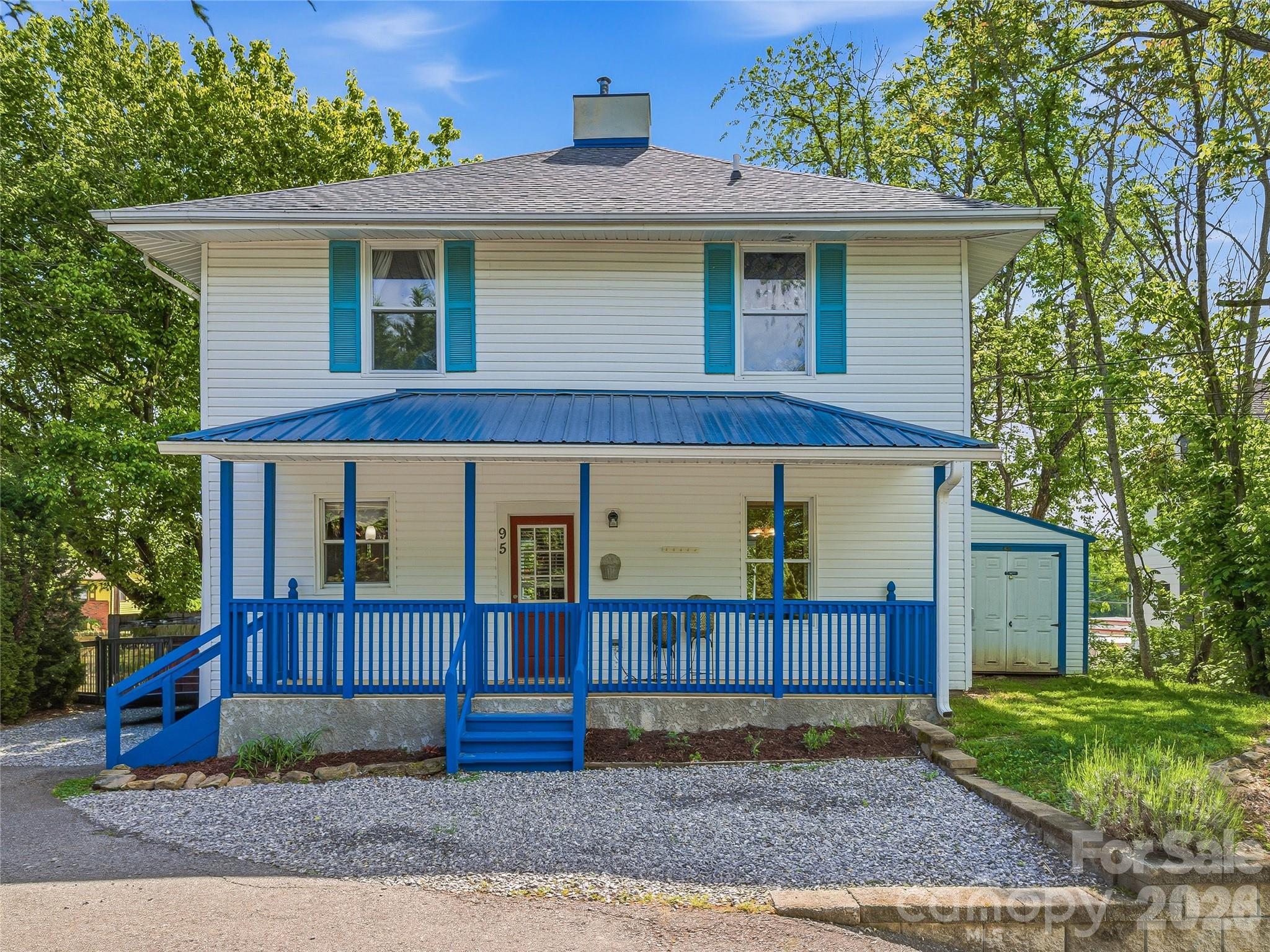Some homes are built. This one was born — in 1910, on a corner lot in the heart of West Asheville, where the streets still hum with the kind of energy that makes people fall in love with this city in the first place.  
Step through the covered front porch and into a foyer that opens to a home completely reimagined for modern living while honoring over a century of character. Original wood floors ground each room in warmth and history, while the stunning open kitchen — granite countertops, stainless steel appliances, tile backsplash, and a center island with breakfast bar — delivers the kind of space where Sunday mornings last all afternoon.
The main level flows effortlessly from the formal dining room through the living areas, with a convenient half bath tucked off the foyer. Upstairs, three bedrooms include a primary suite with a walk-in closet featuring built-in shelving and a full en-suite bath. A second full bath and upstairs laundry keep daily life simple.
Outside, the fully fenced backyard is a private retreat — level, green, and ready for the gardner in you and two sheds offering workshop and storage space. The covered rear porch connects indoor and outdoor living seamlessly.
Situated just blocks from Haywood Road's beloved breweries, restaurants, and local shops, this home puts the best of West Asheville right at your doorstep — with downtown just minutes away and I-26 a quarter mile out. Schedule your private tour today.
