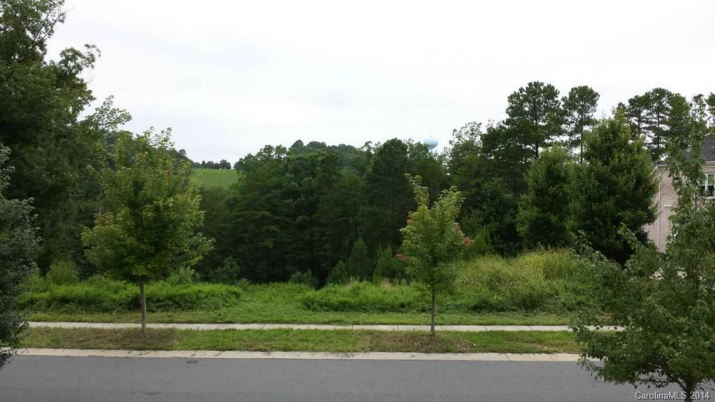 Estate size building lot in Lake Forest, Tega Cay. Golf course frontage. 126 ft wide. High end established neighborhood w home price ranges from high $400's to $1 mil+. This is one of the largest & last approved building lots left. Already cleared & prepped for basement home w retaining wall already in place. Rare opportunity to bring your own builder or build yourself. 2 custom home plans included in sale (Autocad & PDF). Soil test results confirming suitability for construction available.