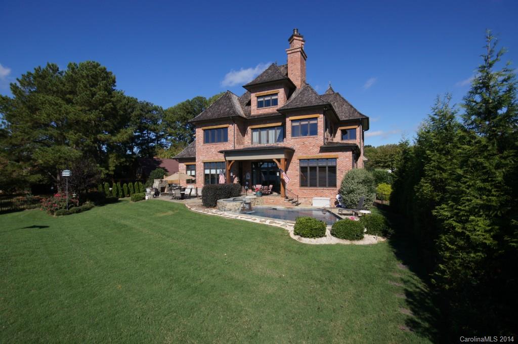 SPECTACULAR WIDE OPEN WATER VIEWS. ONE OF KIND ESTATE WITH POOL/SPA,OUTDOOR LIVING AREA, ELEVATOR, COVERED DOCK WITH BOAT HOIST, 2ND BOAT HOIST, JET SKI HOIST AND JET SKI RAMP. ROOM TO BUILD ANOTHER HOME FOR 2ND RESIDENCE. THERE ARE ACTUALLY 5 BEDROOMS (5 W/ PRIVATE BATHS) AND 1 SHARES WITH BONUS ROOM (WHICH HAS A PARTIAL KITCHEN & FIREPLACE). 1 BDR ALSO HAS IT'S OWN PARTIAL KITCHEN GREAT FOR NANNY OR GUESTS.  LOW TAXES & CLOSE TO I-77...UNBELIEVABLE ESTATE!!  RESORT LIVING AT ITS BEST!