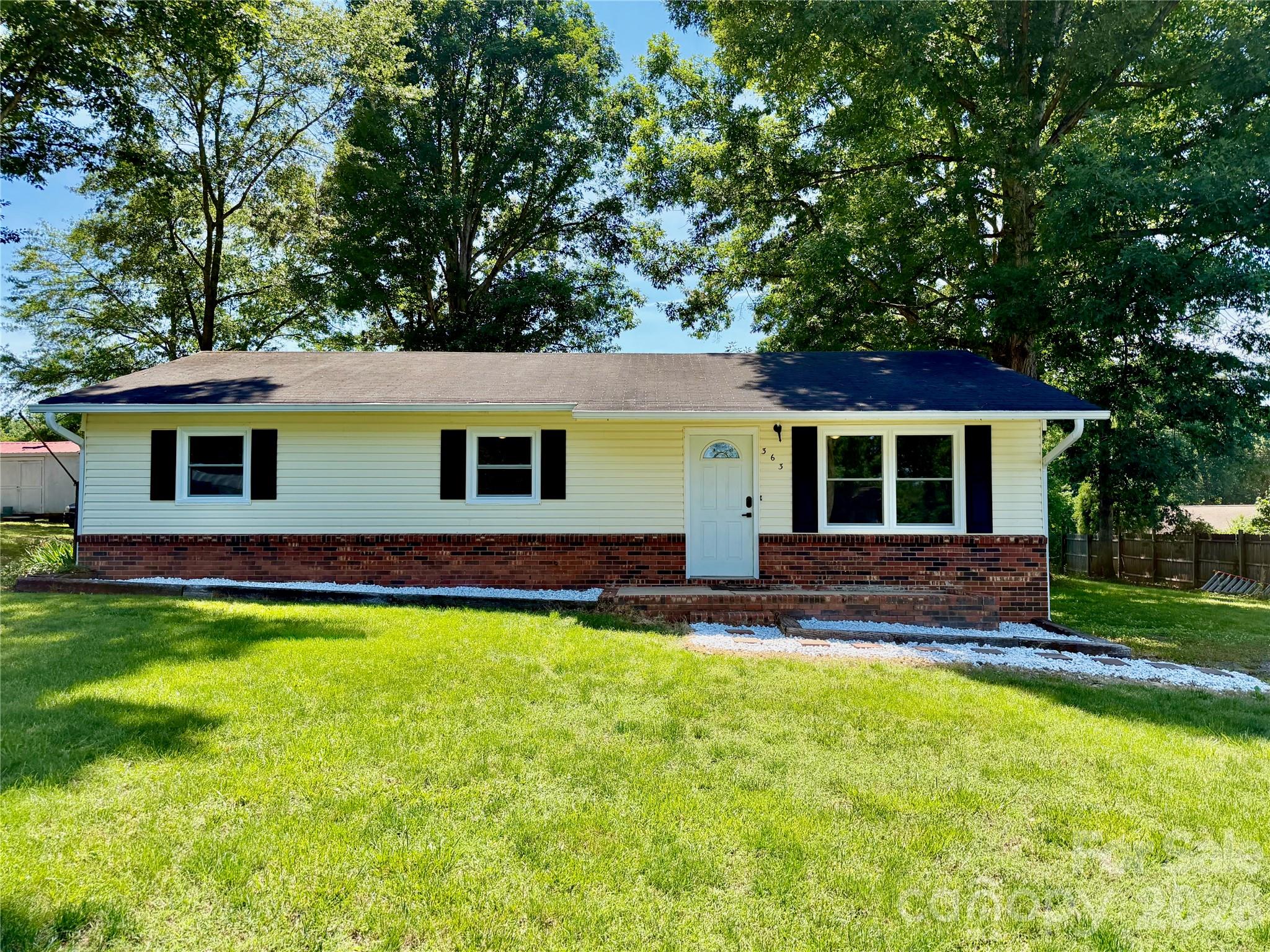 Welcome to 363 Don McGinnis Rd in Lincolnton! This 3 Bed 2 Bath home has been tastefully renovated inside. The kitchen features custom designed soft-close cabinets with quartz countertops throughout as well as all new stainless steel appliances, including the fridge! Both bathrooms have been fully updated with vinyl tile, modern fixtures, and quarts countertops. High end motion activated bidet's in each bathroom and washer and dryer included in the main hall bathroom as well! Home is just beyond the Lincolnton town square, just minutes from all the fine dining and activities that Lincolnton has to offer. Just down the highway, this home is central to Hickory, Gastonia, Denver, Mooresville, and still within commuting distance to Charlotte!