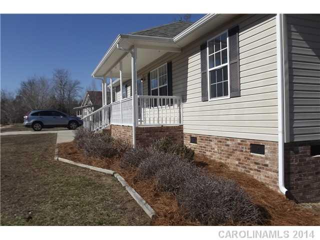 Everything you're looking for in this three bedroom home on a 2 acre lot.  Lots of upgrades including new hardwood laminate in the living room, new carpet in the bedrooms, new ceramic tile in the baths and freshly painted throughout.  All appliances with stove, microwave, refrigerator, washer and dryer.  Large wooded lot and workshop.  Hurry- this will not last!