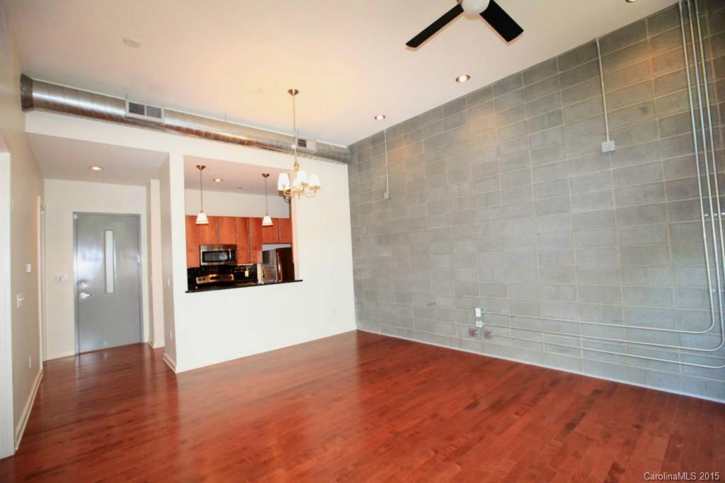 Heart of Plaza Midwood! Walk to Thomas Street restaurants, shops and night life in Midwood. High ceiling loft style in-town living w/hardwood floors in LR and a wall of windows and light facing McClintock Ave. Bedroom features built-in shelves, carpet & modern barn style door.  BR connects to upscale master bath and walk in closet.  Kitchen features granite counter tops w/ dark cabinets & pendant lighting.  Walk in utility room just off entry.  Small pets considered.