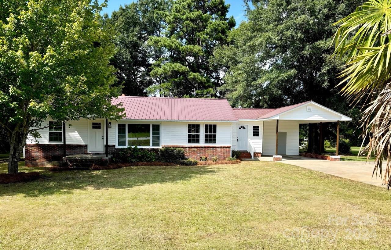 Come on out, this completely remodeled home is ready for you, large den/dining room, completely new kitchen with all new appliances, new cabinets and flooring, home offers 3 bedrooms and 2 baths, large laundry/mud room, with all new electric, plumbing and HVAC, has a metal roof to complete the package. Outside offers a carport with storage room, and a large metal building in back. Lots of trees for shade on a large lot of .76 acres.