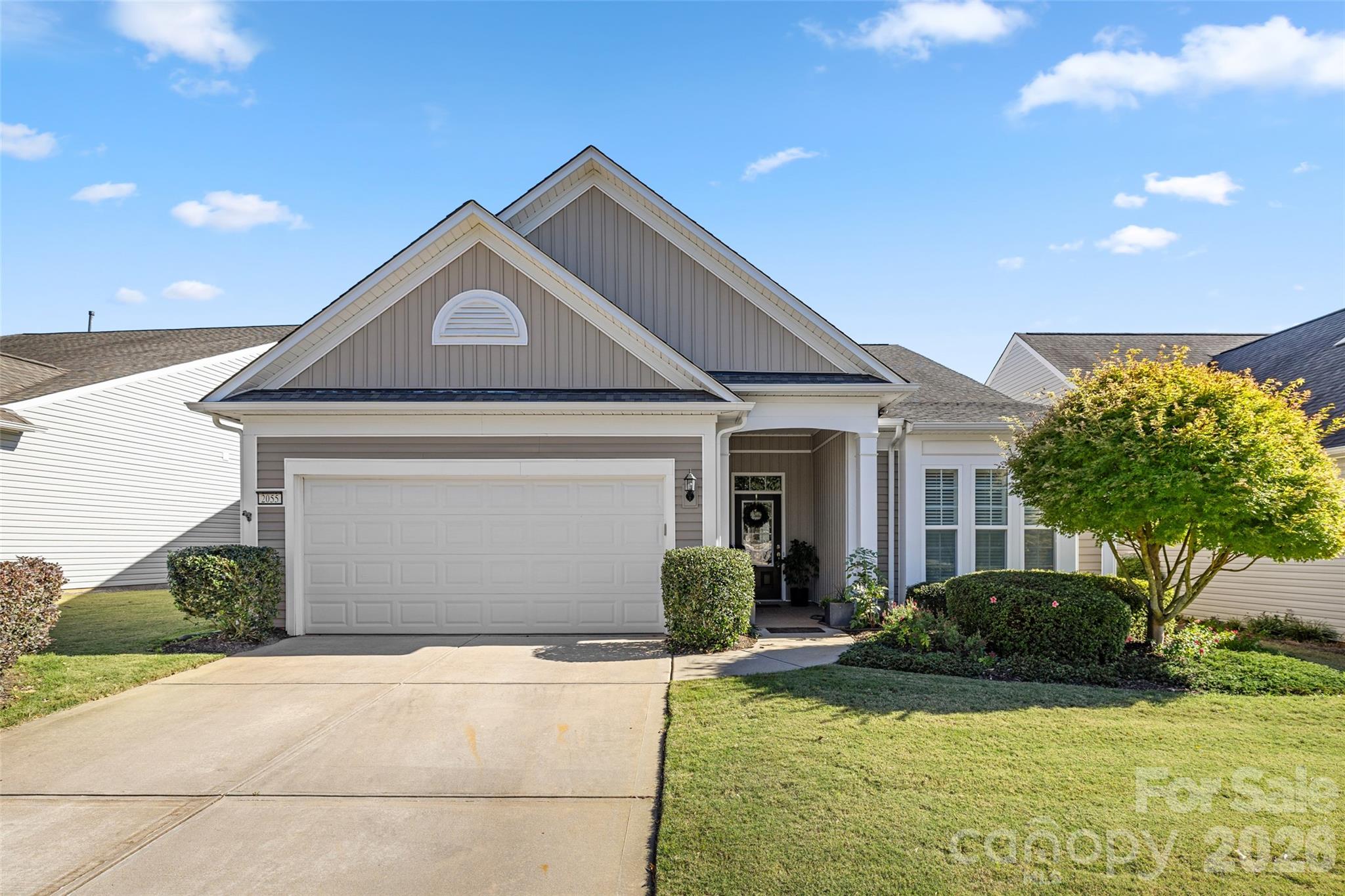 Beautiful Willow Bend model filled with natural light and inviting living spaces designed for comfort and everyday enjoyment. Warm wood flooring flows through the main living areas, and a welcoming foyer with transom window and glass-paneled front door creates a bright first impression.

The fully updated kitchen is a true centerpiece of the home, featuring abundant upgraded cabinetry on both sides of the large granite island, double ovens, a gas cooktop with microwave above, tile backsplash, pull-out drawers, carousel corner cabinet, and upgraded disposal. The kitchen opens seamlessly to the dining area and spacious great room with fireplace, creating an ideal space for everyday living and entertaining. Plantation shutters add timeless charm to the kitchen, dining room, and primary bedroom.

The sunny breakfast area is surrounded by windows and overlooks the front yard, providing a welcoming spot to enjoy morning coffee.

The bright Sun Room offers a relaxing retreat with walls of windows—perfect for reading, hobbies, or simply enjoying the peaceful setting. Just outside, the landscaped brick patio with wooded view creates a private outdoor space for relaxing or gathering with friends.

The home offers three bedrooms, providing comfortable accommodations for guests along with flexible space for a home office or hobby room.

The spacious primary suite features plantation shutters and a well-designed en-suite bath with dual sinks, a separate vanity, and a walk-in shower, creating a functional and comfortable layout.

Located in Sun City Carolina Lakes, residents enjoy a vibrant active-adult lifestyle with resort-style amenities including championship golf, indoor and outdoor pools, fitness center, tennis and pickleball courts, walking trails, lake access, woodworking and craft studios, social clubs, and a full calendar of activities designed for connection, recreation, and everyday enjoyment