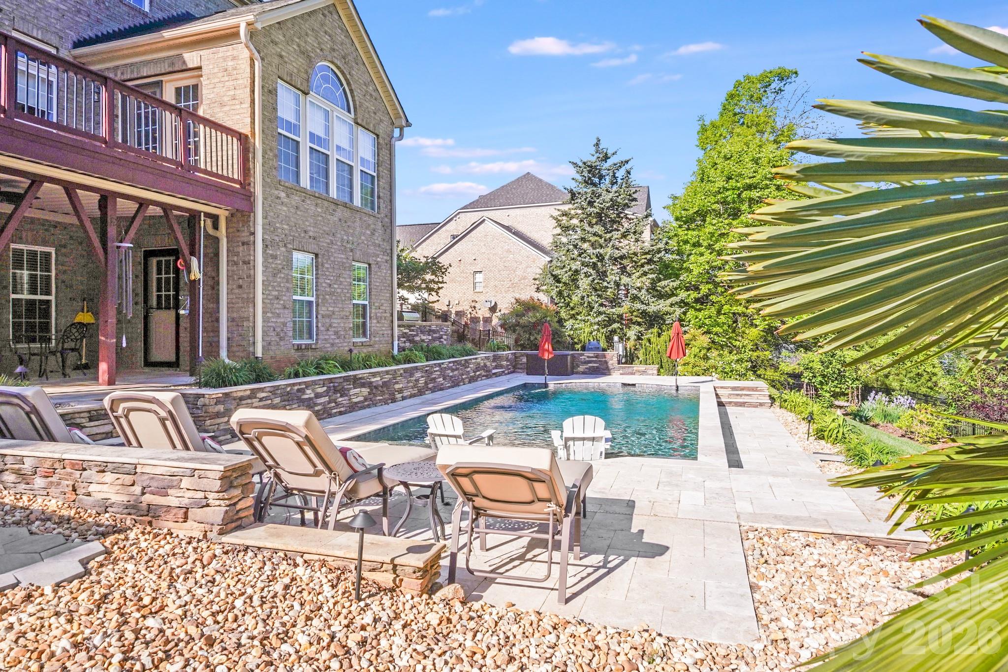 Aggressively positioned for todays market, making this one of the best luxury values currently available in Mint Hill!  Experience classic Southern elegance and modern efficiency in this exceptional 5BR/5.5BA traditional home in Stonebridge, offering more than 6,200 square feet in the heart of Mint Hill. Fully solar powered, this home combines luxury living with energy-conscious design. A new roof was just installed on March 24, 2026, enhancing both value and durability.
The main level showcases hardwood floors throughout and a gourmet kitchen with high-end appliances, custom cabinetry, and expansive prep space that flows seamlessly into gathering areas ideal for entertaining.
Upstairs, the private primary suite provides a peaceful retreat with a beautifully appointed bath. 
The finished basement elevates the home’s entertainment appeal with a dedicated theater room and generous flex space.
Outdoor living is equally impressive with a sparkling pool and fully equipped outdoor kitchen creating the perfect setting for hosting or unwinding. A three-car side load garage and extensive upgrades complete this thoughtfully designed residence in one of Mint Hill’s most sought-after communities.

**Items that do not convey: Outdoor Swing, Outdoor chimes, Outdoor Bell on deck, Patio/Pool Furniture, Outdoor Fire Pit**