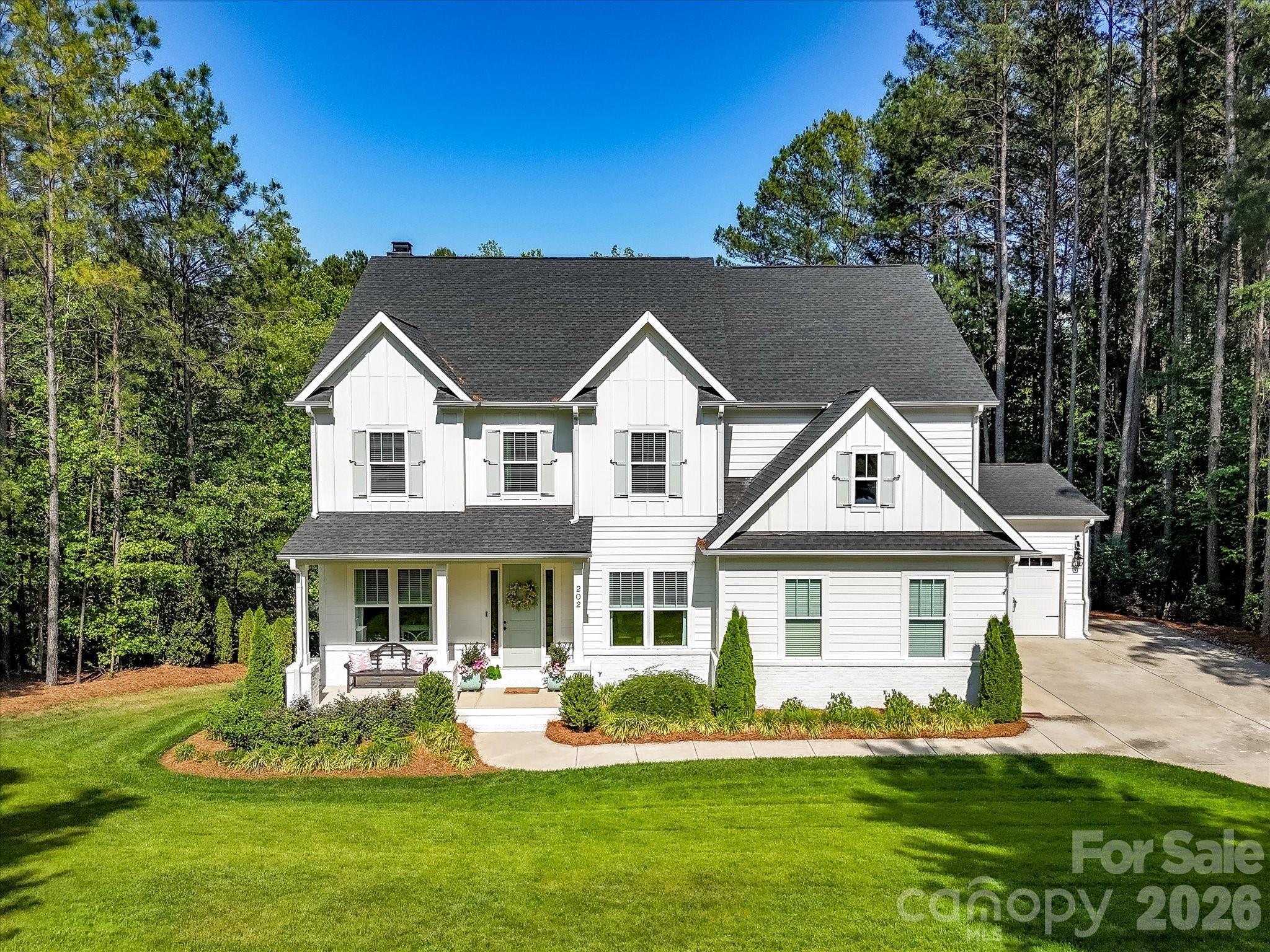 Nestled on a private, wooded lot in desirable Falls Cove near Safe Harbor Skippers Landing and lake access, this stunning custom home offers exceptional indoor and outdoor living with upscale finishes throughout. Inside, you’ll find soaring 10-foot ceilings, durable luxury flooring, abundant natural light, and thoughtfully designed spaces perfect for both everyday living and entertaining. A dedicated, private office & formal dining room greet you upon entry. The gourmet kitchen features impressive 42-inch cabinetry, expansive quartz counters, top of the line appliances, gas cook top with hood system and seamless flow into the main living areas. On the upper level, the luxurious primary suite offers a tray ceiling, spa-inspired bath with dual vanities, soaking tub, oversized walk-in shower, and spacious walk-in closet. Generously sized secondary bedrooms, versatile flex spaces including a Bedroom/Bonus Room are ideal for a home office, gym, or media room, and a convenient Jack-and-Jill bath provide flexibility for any lifestyle. Outdoor living shines with a screened porch & large deck overlooking the beautifully landscaped backyard complete with a firepit gathering area, fenced lawn, and peaceful views. Additional highlights include a spacious laundry room, abundant storage, unfinished, walk out basement with endless potential, covered patio, 3-car garage, and low-maintenance fiber cement exterior for lasting beauty and durability. With plenty of room for a pool, this property is ideally situated just minutes from Lake Norman, dining, shopping, healthcare, Lake Norman State Park, downtown Troutman & convenient to Mooresville. This showcase property is a true MUST SEE!