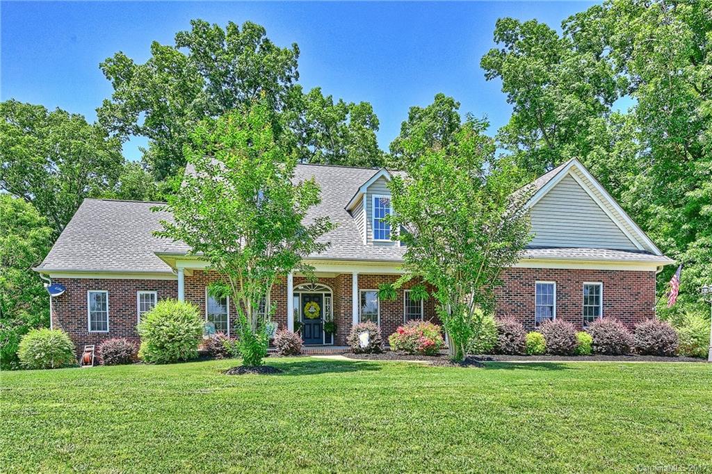 Full brick custom home on 1.66 acres! Beautiful country setting with no HOA. Features include: rocking chair porch, master, laundry and 2 secondary bedrooms on main, bonus and office on upper, each bedroom features a private bath, Kempas hardwoods throughout most of the main, spacious kitchen with stainless appliances and double oven, Corian counters with bar area and raised panel custom cabinetry, walk-in attic storage, 4 car side load garage, 3 tiered deck and storage building. Cabarrus taxes!
