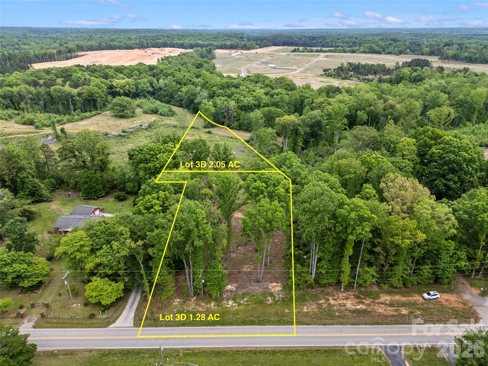 Look no further for your new homesite already perked for a 5 bedroom septic! This 2.05 acre homesite on Henry Harris Rd is a blank canvas ready for you to make it your own. Lot 3B features gentle hills that provide you the prime opportunity for a basement home with endless possibilities. With the lot recently surveyed and perked and permitted for an engineered 5 bedroom system there's no guess work about what you can achieve on this lot. The lot has been mostly cleared making it easy to walk and plan out your vision while also cutting build costs. Lot 3B is just minutes away from Marvin, Waxhaw, Fort Mill, and Ballantyne and only a short commute to downtown Charlotte. With the elevated homesite looking over the preserved Heelsplitter Overlay District you'll always have an abundance of privacy and seclusion! Don't miss this prime land opportunity!