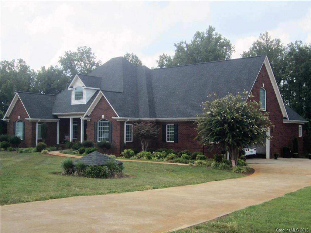 Absolutely Beautiful Brick Home, offers over 6000sf, arched entry, great room w/cathedral ceiling, fireplace w/gas logs, hardwood floors, sunroom, kitchen w/ breakfast area and bar, lots of cabinets, formal dining room, large master bedroom w/ walk out door and private bath w/walkin tile shower & corner tub, bonus room w/half bath, basement has living rm and recreation rm, wood burning fp  and workshop w/ garage door, inground pool, 2 car garage and additional lot available to purchase. $499,900