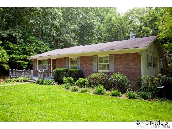 Sneak ten minutes from downtown & settle into seclusion. Spacious brick ranch offers lots of options with large living, family & dining rooms, basement and 1248sf three-car garage/workshop. Bask in the sun on the front porch, cook together in the big kitchen and then cozy up by the fire under vaulted skylights or open the french doors to a quiet woodland paradise. This private property has great lifestyle, home business & investment potential.