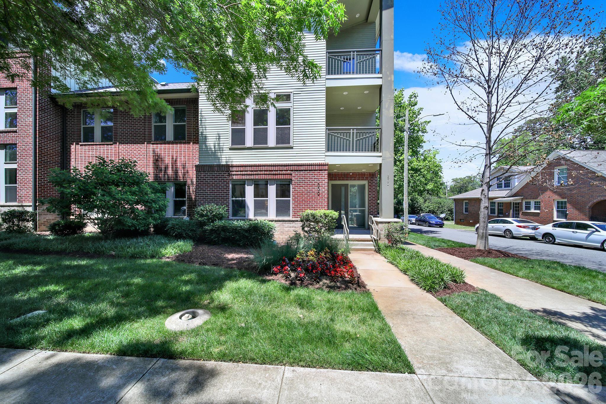 Rare corner residence offering more than 2,500 square feet in the heart of Dilworth. Spanning three levels, this four-bedroom, three-and-a-half-bath home offers the space and functionality of a single-family home with the convenience of low-maintenance condominium living. The open-concept main level features hardwood flooring, a large center island, beverage refrigerator, wine refrigerator, and seamless flow between the kitchen, dining, and living spaces. Hardwood flooring continues throughout all bedrooms and living areas, creating a cohesive feel across the home. The spacious primary suite includes a private balcony, walk-in closet, and oversized bath. Additional bedrooms and a third-floor loft provide exceptional flexibility for guests, remote work, fitness, hobbies, or bonus living space. An attached garage, assigned parking, guest parking, and rental-friendly HOA policies add to the home's appeal. With no rental cap and a minimum lease term of only 15 days, the property offers flexibility for both owners and investors. Located moments from Freedom Park, Atrium Health, Uptown, South End, and East Boulevard's dining and shopping destinations, this is a rare opportunity to enjoy the location, space, and convenience that make Dilworth one of Charlotte's most sought-after neighborhoods.