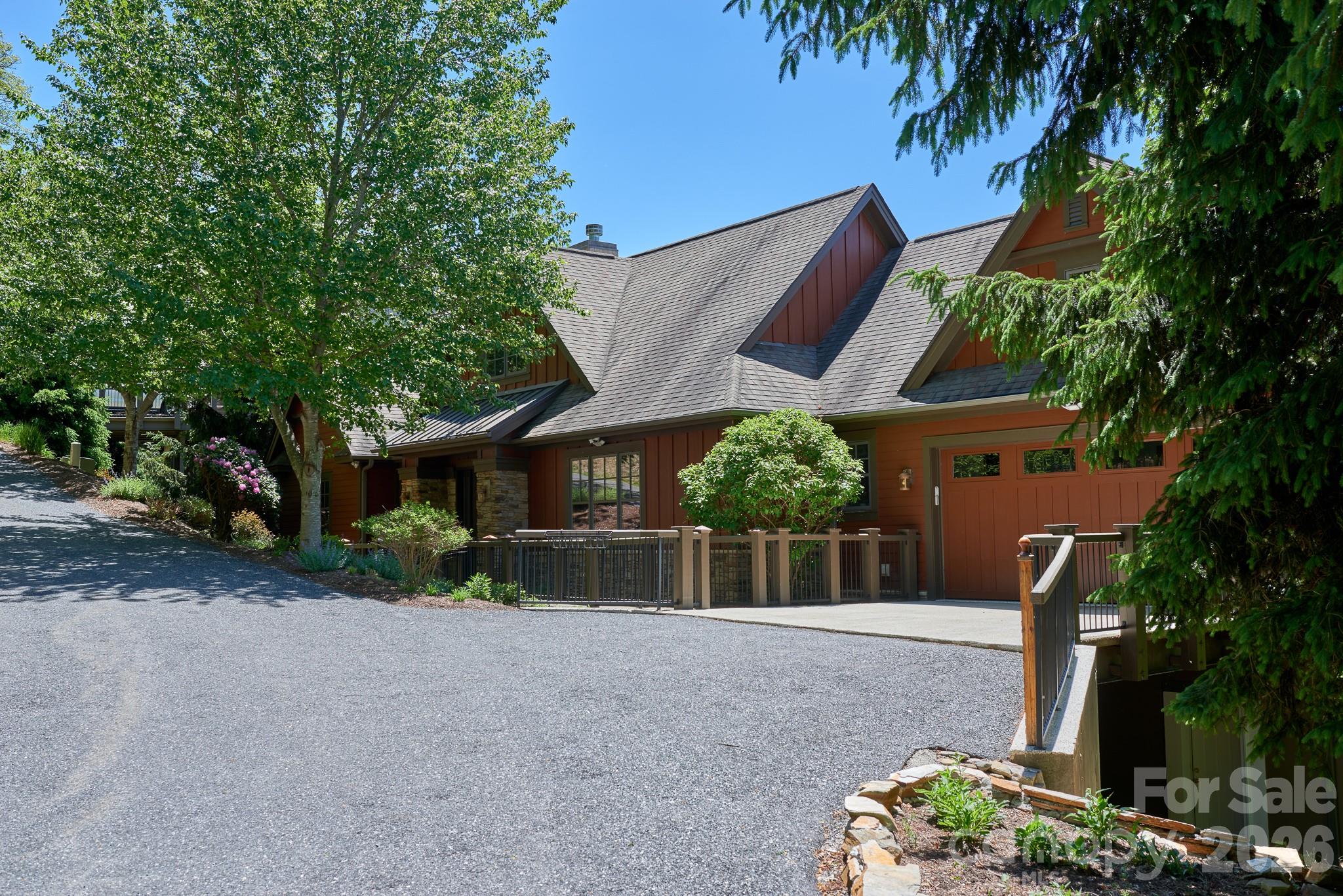 This impressive 5BR/4BA home is offered fully furnished and located in the highly desirable Spring Rock neighborhood. Perched at nearly 4,000’ elevation, Spring Rock is known for offering some of the most breathtaking sunset views on the mountain! You'll enjoy mountain vistas, spectacular sunsets, and the peaceful beauty of the protected Old Growth Forest — creating a serene setting unlike any other!

Beautifully maintained and updated, the home features an open-concept great room with stone fireplace, soaring ceilings, and gorgeous hardwood floors throughout. The spacious kitchen is equipped with new SS appliances, while the oversized island provides ample space for cooking, gathering, and entertaining.

The main level includes a luxurious primary suite complete with his-and-her closets, an updated en-suite bath with glass-enclosed shower, heated tile floors and a built-in beauty station. A second bedroom and conveniently located laundry room with added sink are also found on the main level.

Downstairs offers three oversized guest bedrooms — two with en-suite baths — along with a spacious family room that opens to a covered deck, perfect for enjoying cool mountain breezes and sweeping mountain views! The newly added third oversized bedroom features high ceilings, luxury vinyl plank flooring, a large closet, additional storage closet and direct access to the 538 sqft workshop. The spacious workshop includes an exterior steel-enforced door for additional ingress/egress and a stone walkway providing easy access to the main level.

Expansive deck spaces on both levels create the ideal setting for outdoor entertaining, relaxing, and taking in the surrounding natural beauty. The main-level deck features a cozy gas-log fireplace — perfect for enjoying cool mountain evenings while soaking in the breathtaking views. Additional highlights include window treatments throughout, a spacious two-car garage with epoxy-finished floors and driveway, and fresh exterior paint.

Set within our exclusive gated community featuring 24/7 manned guard gate.  All residents enjoy access to 6+ miles of hiking trails, 7 parks, and the highest elevation runway east of the Mississippi. Additional on-site amenities at Mountain Air Country Club include an 18-hole golf course, state-of-the-art fitness center, club dining, Lodge, ProShop, tennis, pickleball, and a vibrant calendar of social activities.  Access available with Club Membership.  Full golf membership and golf cart negotiable.