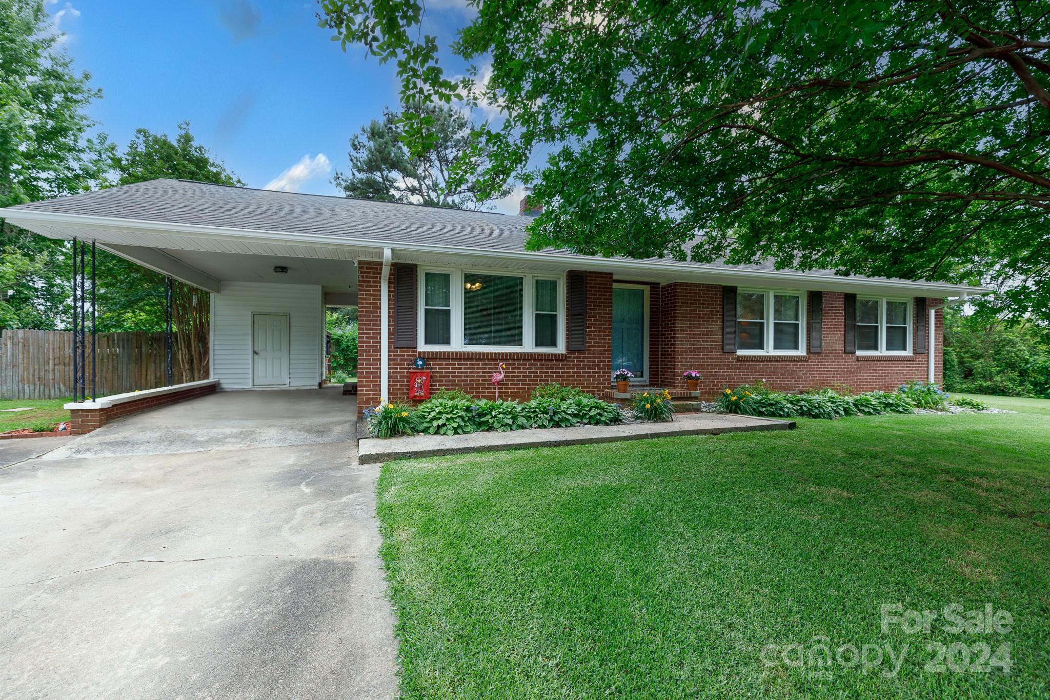 Welcome to your dream home! This charming brick ranch, nestled on a corner lot spanning 0.44 acres, offers the perfect blend of comfort and convenience. This property features an attached carport with a storage area, perfect for accommodating your vehicles and outdoor gear. Step into the privacy-fenced backyard retreat, complete with a paver patio with a hardtop gazebo as well as a shed. Inside, you'll love the kitchen featuring granite countertops, a stylish tile backsplash, plenty of cabinets, a pantry, and a gas range and oven. The hall bath showcases a luxurious tile shower, adding a touch of elegance to everyday routines. Situated in a prime location close to parks, shopping, dining, and the interstate, this home offers the perfect balance of tranquility and accessibility. Don't miss the opportunity to make this your own slice of paradise!