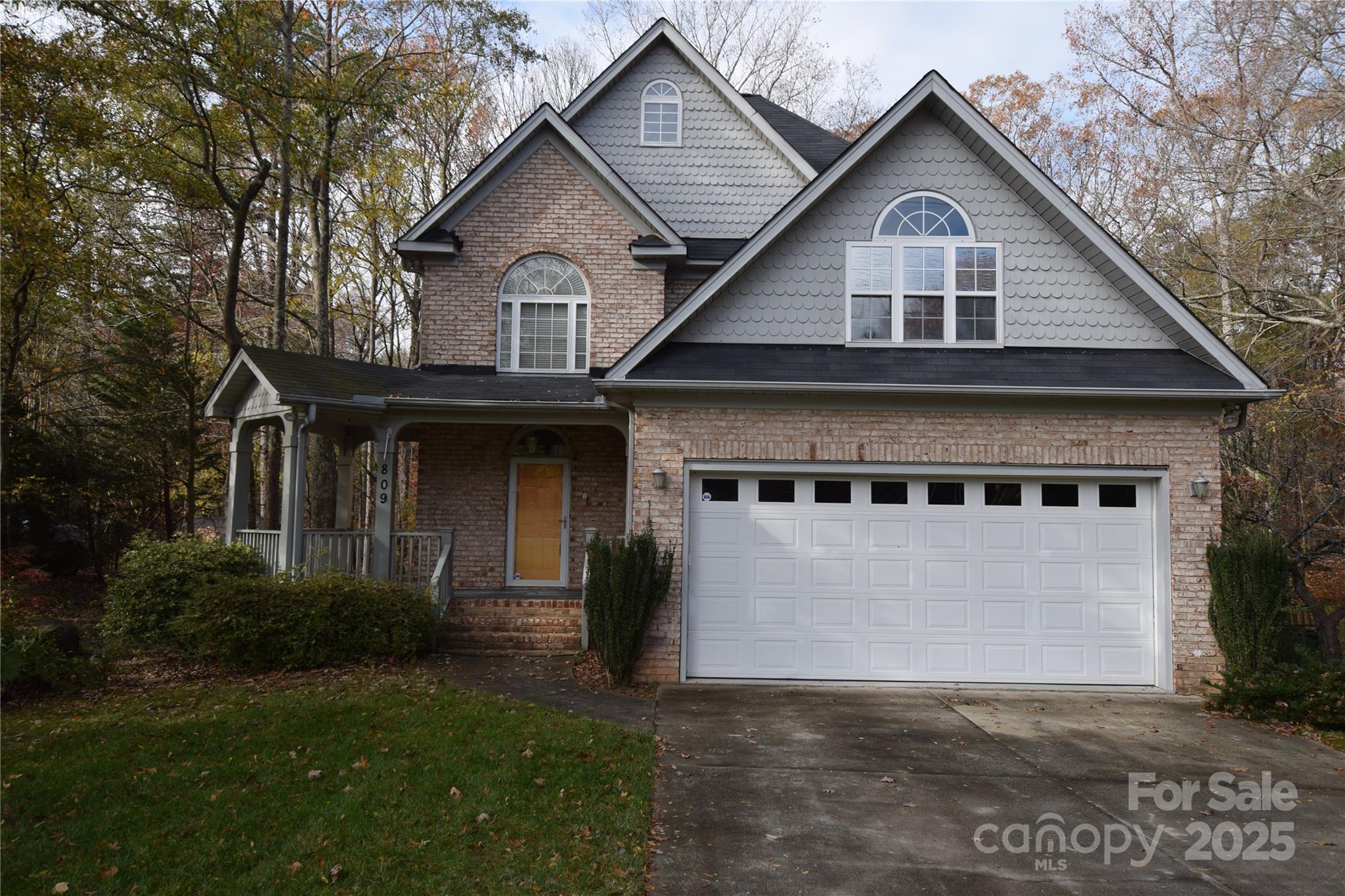 Unique two story with basement in golf course community. Nice covered front porch to sit back and rock. Great room has been remodeled removing raised dining area to open up room with gas fireplace. Primary bedroom has huge walk-in closet with extra room for storage and flex room behind closet perfect for arts and crafts also with walk-in attic storage.. Primary also has gas fireplace, screened porch and laundry chute. Primary bath features jetted tub with picture window with wooded view and jetted shower.  Deck off kitchen with view of large, wooded lot. Laundry room has built in desk and cabinets with sink and counter for folding clothes. Walkout basement features two bedrooms full bath and den. storage building in rear of property. Neighborhood features optional country club with nice restaurant, golf course and pool. Membership fees vary for social, pool or golf.