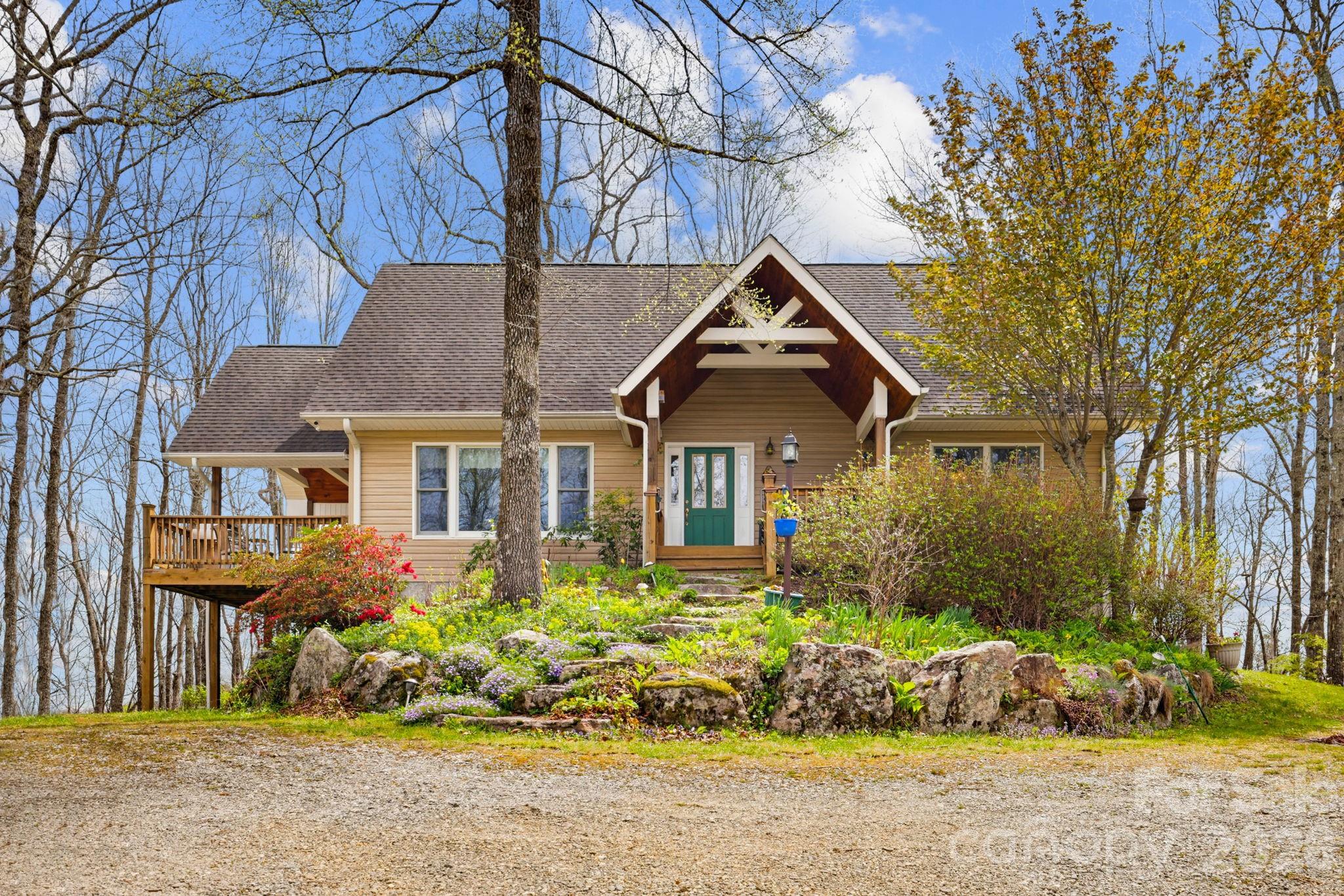 Whether you're looking for a full time mountain residence, vacation home, or investment property, this home offers an exceptional opportunity to enjoy the natural beauty and peaceful lifestyle that makes Lake Toxaway living so special.  Conveniently located between Brevard and Cashiers this 3 bedroom, 3 bath home is designed to provide comfort, privacy, and incredible 360 degree year round mountain views. The primary bedroom is located on the main level, while the upper level features a private guest bedroom, loft for office and full bath.  The lower level offers an additional bedroom and full bath, along with a large den or family room perfect for entraining, relaxing, or creating a media space. The downstairs area also has a separate entrance. The main living area features an open floor plan with a stunning rock fireplace, creating a warm and inviting gathering space that flows beautifully for both everyday living and entertaining.  Step outside onto the covered main level deck, where you can take in the breathtaking mountain views in every season. Call today for a showing!