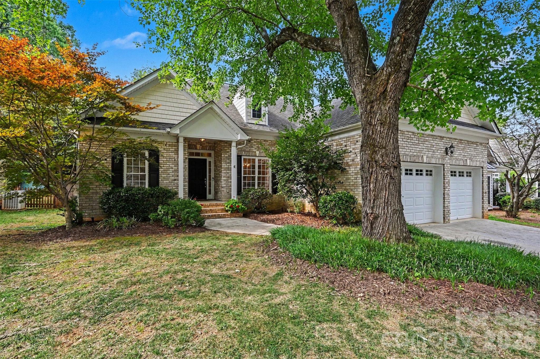 CLICK VIRTUAL TOUR FOR VIDEO WALKTHROUGH - Beautifully maintained ranch style home tucked away on a quiet, tree-lined cul-de-sac in the desirable Southern Oaks community. Ideally located just minutes from SouthPark, Cotswold, and Uptown Charlotte, this move-in ready home offers the perfect combination of comfort, convenience, and low maintenance living. Inside, the open floor plan features soaring vaulted ceilings, abundant natural light, rich hardwood floors throughout the main living areas, and a cozy gas fireplace that anchors the spacious living room. The updated kitchen is both stylish and functional with quartz countertops, white shaker cabinetry extended to the ceiling, ceramic tile backsplash, stainless steel appliances, and a gas cooktop, all flowing seamlessly into the bright breakfast nook. The split-bedroom layout provides exceptional privacy, with the spacious primary suite offering a tray ceiling, large walk-in closet, dual-sink vanity, oversized tiled shower, and relaxing garden tub. Two additional bedrooms and a full bath offer flexibility for guests, family or a home office. Step outside to your own private retreat featuring a fully fenced backyard surrounded by mature privacy trees, an expansive patio, and a pergola, creating the perfect space for entertaining or relaxing. Additional updates include a new furnace (2024), water heater (2023), and air conditioning system (2019). This exceptional home is ready for its next owner.