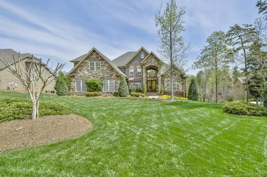 Elegant open flow moments to Charlotte!  Custom craftsmanship at every turn.  Stunning Master AND Guest Suites on Main Level.  HUGE “ready to finish” basement with pool ready private level lawn just awaiting your touch.  Formal Living or Study.  Designer Kitchen with stunning 10 ft. cabinetry, Jenn Aire appliances, dbl ovens, gas cooktop.  Gorgeous maple wide plank hardwoods.  Extensive granite and millwork.  Incredible “ready to finish” walk up Attic. 5 car garages – 3 on upper level, 2 below.