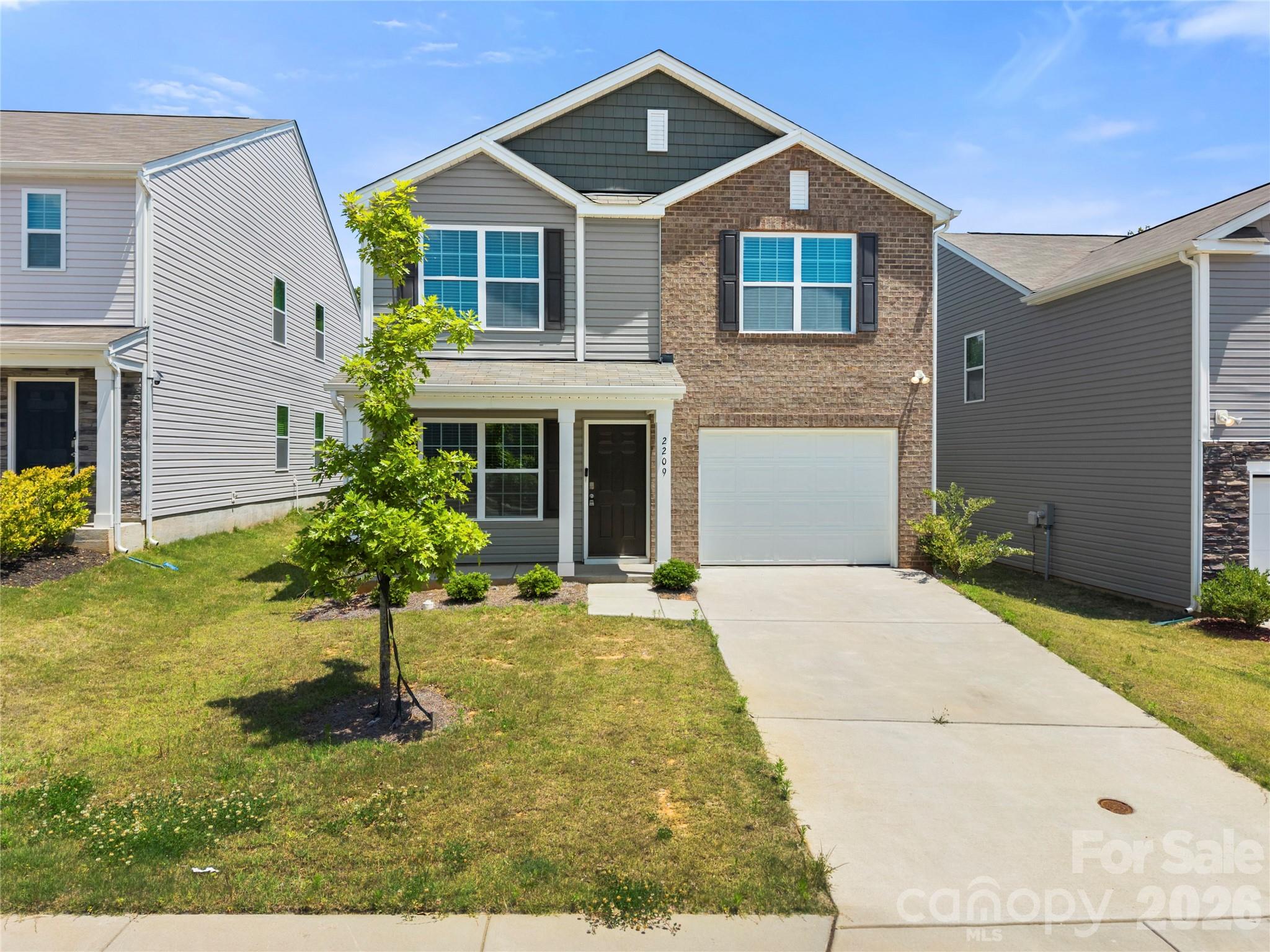 Built in 2023, this two-story home in Stewart Creek Estates is a must-see. Enter through the covered front porch into a living room featuring LVP flooring. The kitchen features granite countertops, stainless steel appliances, a pantry and a breakfast nook. A conveniently located half bath completes the main level. Upstairs, the primary suite offers a walk-in closet and an ensuite bath with a double vanity and walk-in shower. Two additional bedrooms, both with walk-in closets, a full bath with a tub/shower combination, and a laundry closet complete the upper level. With the home being built in 2023, you’ll have peace of mind knowing the roof, HVAC, and water heater are all just a few years old. Conveniently located with access to I-85, I-77, Uptown Charlotte, Charlotte Douglas International Airport, as well as shopping and dining, this home truly has it all.