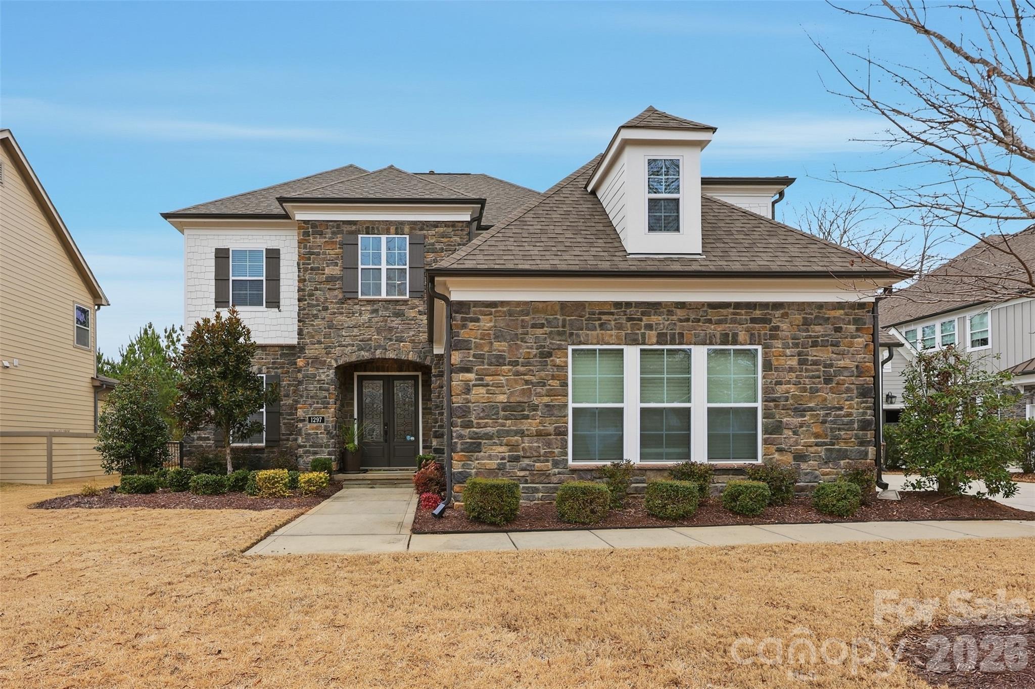 Welcome to 1297 Edbrooke Lane, a beautifully maintained home ideally positioned on a quiet cul-de-sac in the highly sought after Springfield neighborhood of Fort Mill. Set on a private, golf adjacent lot just steps from the 15th hole, this home offers the perfect blend of tranquility, elegance, and an exceptional lifestyle.

From the moment you arrive, you'll appreciate the thoughtfully designed floor plan that balances everyday comfort with effortless entertaining.  The main level features spacious, light-filled living area with quality finishes and a seamless flow throughout.  The open concept kitchen serves as the heart of the home with a large center island ideal for entertaining.  

The primary suite provides a peaceful retreat, complete with a spa-inspired bathroom, oversized shower, and a walk in closet.  Additional bedrooms are well appointed and offer flexibility for guests, home office space or recreation.  

Step outside to enjoy the private screend in porch with fireplace and fenced backyard with trees surrounding. 
Springfield offers residents resort style amenities including a golf course, pools, clubhouse, fitness center, walking trails, playgrounds, tennis and pickleball courts.