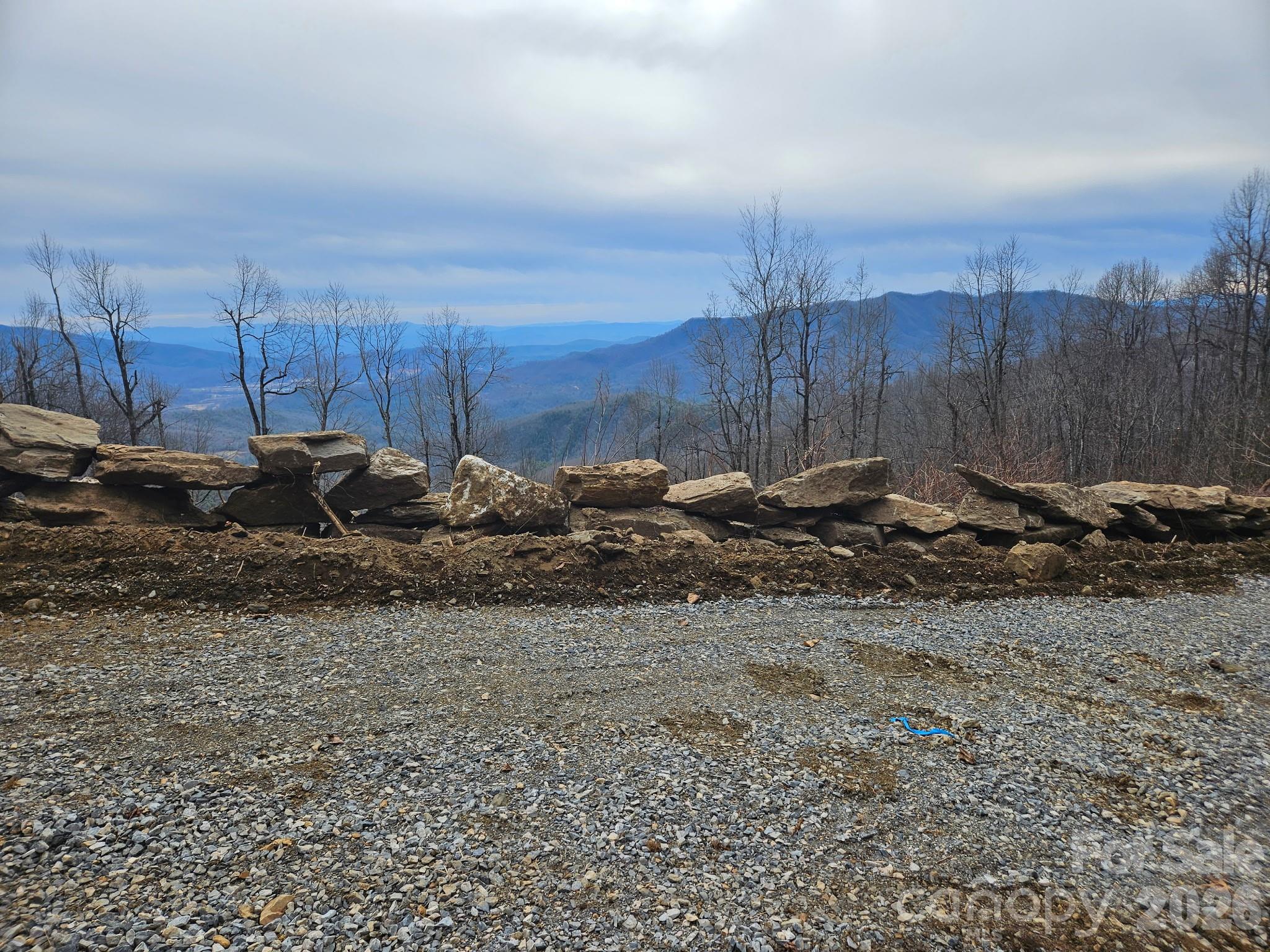 One of the last PREMIER VIEW LOTS left in Little Switzerland. 180 degree views looking South and East. Take in the panoramic views of Hawksbill, Table Rock. Linville Mountain, Woods Mountain, Pompey's Knob and the South Mountain Range. Located off Historic Osbourne Knob which was part of the original 1909-1910 Judge Hariot Clarkson Switzerland Company Development tract. A rocks throw from the Blue Ridge Parkway at an elevation of roughly 3,300 feet. Enjoy evenings at the nearby Switzerland Inn, dining in the lodge or The Foul Play Pub....featuring music on the weekends. Spend a relaxing afternoon at one of the local wineries or at Lake James. Just a short drive to Asheville, Boone, Banner Elk and Johnson City, TN. Several hiking trails, golf courses and ski resorts close by. New Survey and an improved road already into the property. Perfect place to build your Dream Home.