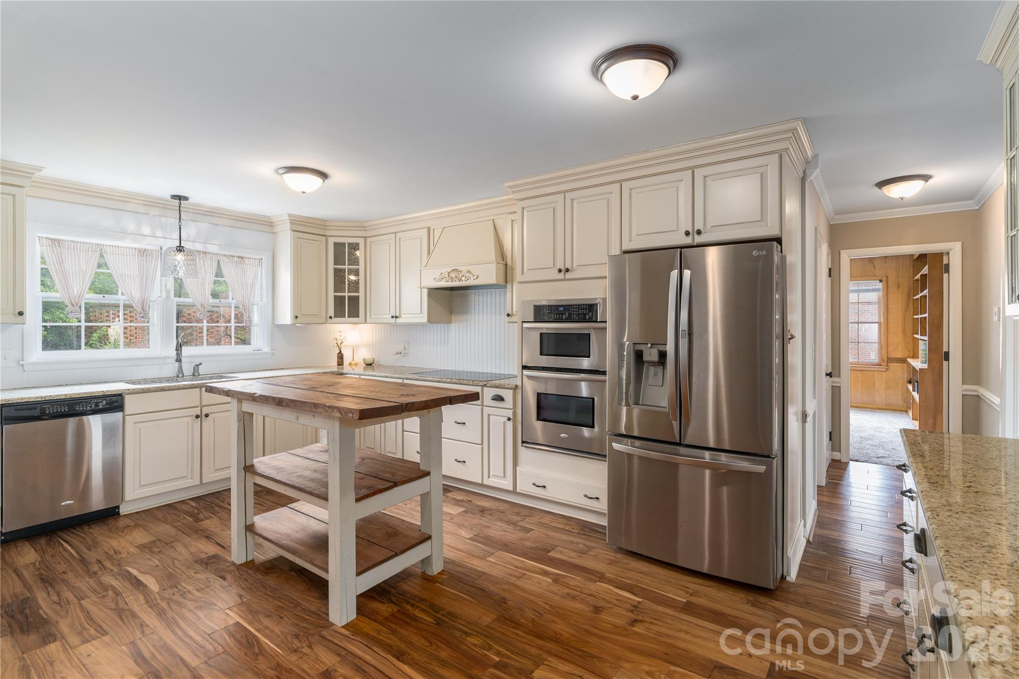 Newly priced to reflect current market. Beautiful brick home situated on approximately 0.64 acres featuring approx. 2,900 HLA plus approx. 1,190 partially finished basement.  The inviting interior showcases abundant natural light throughout,  original hardwood flooring in the great and dining rooms and a well-designed layout for both everyday living and entertaining.

The kitchen features granite countertops and stainless steel appliances, opening to a separate breakfast nook as well as a formal 13x13 dining room.  There is also a versatile 11x19 flex space on the main level.

Outdoor living space is just as impressive with a private brick-fenced rear courtyard complete with firepit, creating an extremely functional  entertaining area.  The front porch is generously sized for rocking chairs and offers privacy added privacy with mature landscaping. All of this with no HOA!!!!