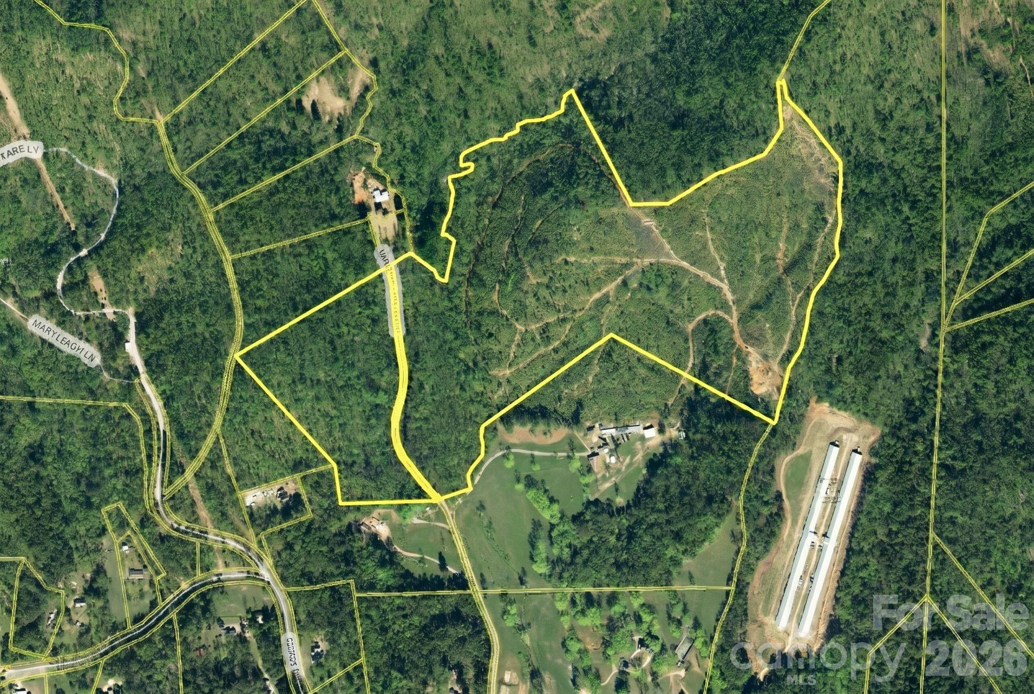 Hunters, hikers, and homesteaders — this is your moment. Nearly 57 acres of raw Carolina foothills land awaits, complete with two streams, rolling terrain, and the kind of peace that's getting harder to find. Timber was harvested years back, leaving the land open with natural regrowth well underway. Power lines run along the road frontage, so the infrastructure groundwork is already there. And for those with a bigger vision, two adjoining parcels may also be available — giving you the rare chance to assemble an even larger foothold in the foothills. Come build, explore, or simply hold — land like this doesn't stay on the market long. Must be accompanied by your buyer's agent or listing agent to view the property.