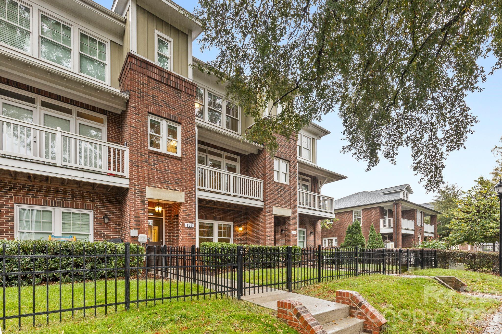 Now offered at $565,000, 129 Grandin Road presents an exceptional opportunity to own in Charlotte’s vibrant Wesley Heights neighborhood, just minutes from Uptown. With three levels of thoughtfully designed living space, a two-car garage, multiple outdoor living areas, and nearby restaurants and breweries, this home delivers the location, flexibility, and lifestyle today’s buyers are seeking.

The open-concept main level creates an easy flow between the kitchen, dining, and living spaces, making everyday living and entertaining equally comfortable. Large windows bring in natural light, while flexible spaces provide options for a home office, guest accommodations, workout area, creative studio, or additional gathering space.

Enjoy multiple outdoor areas designed for everything from morning coffee to relaxing evenings among the trees. Whether hosting friends or unwinding at home, the indoor and outdoor spaces work beautifully together.

Located near Uptown Charlotte, the Gold Line streetcar, Stewart Creek Greenway, local restaurants, breweries, parks, and neighborhood favorites, this home keeps you connected to everything that makes Wesley Heights such a compelling place to live.

Freshly updated with new virtual staging to showcase its full potential, this home combines location, flexibility, outdoor living, and exceptional value. Schedule your showing today and experience everything 129 Grandin Road has to offer.