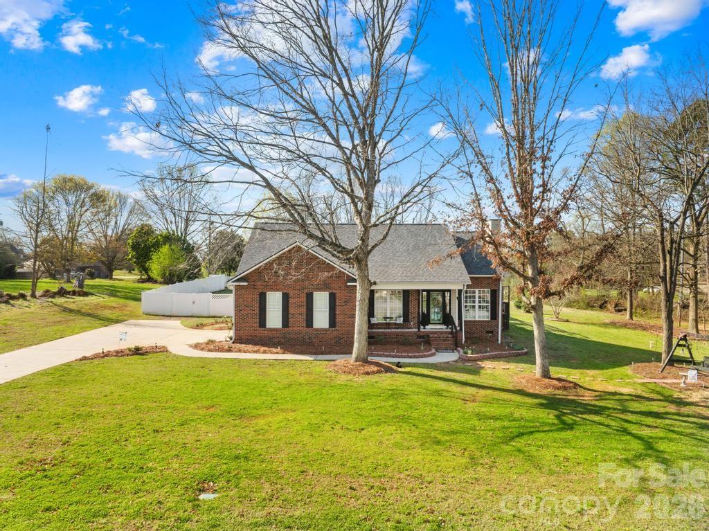 Country charm meets neighborhood living in Cherryville, NC! Welcome to 105 Laura Court

Tucked away on a quiet cul-de-sac, this charming Cherryville property offers the perfect blend of peaceful country living and neighborhood convenience. Situated on nearly 2 acres, the home provides space, privacy, and a serene setting surrounded by mature trees—ideal for those looking to unwind without sacrificing community.
Inside, you’ll find nearly 1,500 square feet of comfortable living space, thoughtfully updated to enhance both style and functionality. Recent upgrades include a brand-new roof (Oct 2024), fresh interior paint throughout most of the home, and modern stainless-steel appliances that bring a clean, updated feel to the kitchen. Smart features like a smart thermostat and smart front door lock add everyday convenience and efficiency.

Outdoor living truly shines here. Enjoy relaxing or entertaining on the improved back deck with added privacy lattice, or take advantage of the above-ground pool—perfect for warm Carolina days. The spacious yard offers endless possibilities, enhanced by professional landscaping with flowers, shrubs, and natural elements that create a welcoming curb appeal.

Additional value comes from practical enhancements like a vinyl fence for added privacy, a utility building for extra storage, and thoughtful touches that make this home move-in ready.

If you’ve been searching for a property that combines modern updates, outdoor space, and a peaceful setting within a neighborhood, this one checks all the boxes—and won’t last long.