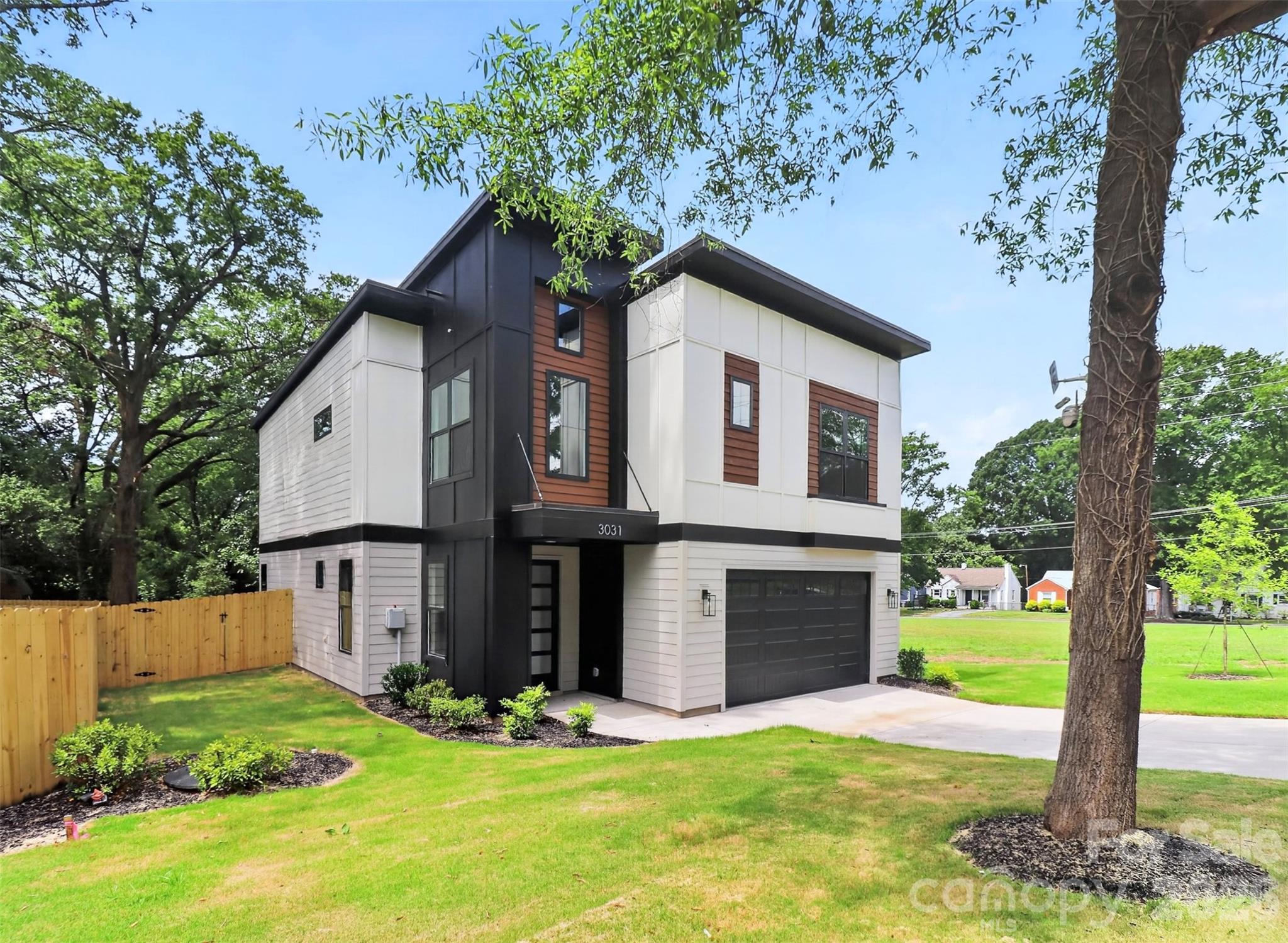 This beautifully designed modern residence is currently complete and move in ready, offering you the rare opportunity to be the first owner to enjoy this spectacular build from KO Construction. On a large quarter-acre lot, enjoy prime location in Enderly Park with easy access to nearby retail and restaurants. Step inside to an open, spacious living area that flows seamlessly into a large gourmet kitchen and dining space – perfect for entertaining. Elevated modern finishes impress at every turn: beautiful engineered hardwood floors throughout, custom-level tile in the kitchen and bathrooms, and sleek, high-end selections that elevate the entire home. All kitchen appliances are included! Prepare to be wowed by the primary suite – an expansive retreat with generous space and luxurious details. The home features a convenient two-car garage, sodded front yard, and a fully fenced backyard. Complete with a builder warranty for complete peace of mind. Don’t miss your chance to own a brand-new home in one of Charlotte’s most desirable up-and-coming areas! This home qualifies for an attractive lending program with incentives, please inquire for more details or to schedule a showing. FreeMoreWest and Thrift Road districts are home to beloved local spots like Pinky’s Westside Grill, Noble Smoke, Town Brewing Co., Restaurant Constance, and Pizza Baby. You’re also steps from Front Porch Sundays—one of Charlotte’s premier open-air community markets featuring local artisans, live music, and food vendors.