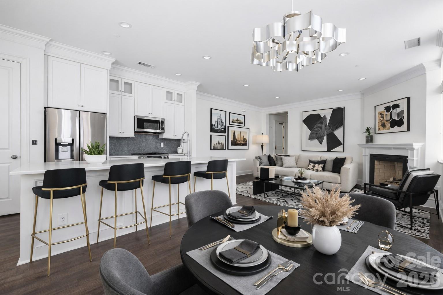A unique chance to own a notable piece of Charlotte’s architectural legacy, ideally situated in the heart of Uptown at 229 N. Church. This beautifully maintained 2-bedroom, 2-bath corner unit offers main-level access & blends timeless exterior charm w/modern interior updates, perfect for the discerning buyer. The spacious layout includes an updated kitchen w/contemporary finishes, a renovated primary bathroom, & fresh interior paint, creating a polished, move-in ready space. As a corner unit, natural light floods the living area & kitchen, while both bedrooms feature exterior windows—an uncommon luxury in Uptown condo living. This exclusive building features a rooftop terrace shared among a select few—ideal for enjoying city views & quiet evenings above the buzz of downtown. Secure, private garage parking provides convenience, plus a dedicated basement storage unit. CLT's finest dining, entertainment, & cultural venues at your fingertips w/an exceptional blend of privacy, luxury, and urban accessibility.