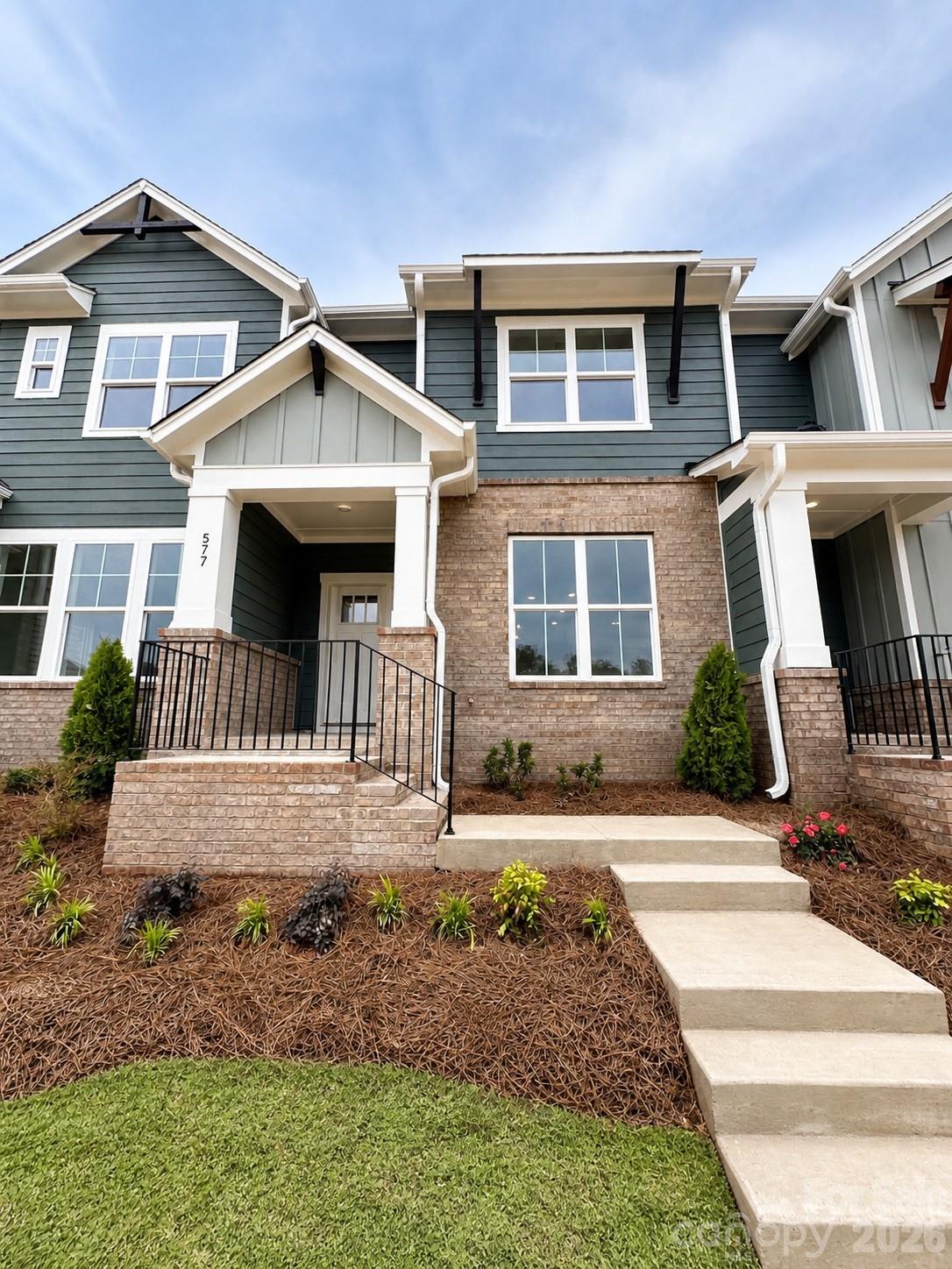 July Move-In! This quick-move-in home by David Weekley Homes, is under construction in Rock Hill’s newest community, Hardy Pond. This thoughtfully designed interior-unit townhome features a desirable 2-car rear-load, alley-fed garage, adding both charm and functionality.

The exterior showcases extensive brick and Hardie® board siding, creating timeless curb appeal that sets these townhomes apart.

Inside, you’ll find luxury vinyl plank flooring throughout the first floor and on the stairs, offering both durability and style. The beautifully appointed kitchen includes upgraded cabinetry, quartz countertops, a tile backsplash, stainless steel gas range/cooktop, and MDF shelving in the pantry — just a few of the elevated finishes that make this home stand out from the rest.

Built with David Weekley Homes’ renowned dedication to quality craftsmanship and attention to detail, this quick move-in opportunity blends comfort, design, and convenience.

Hardy Pond offers a prime location within walking distance to restaurants, grocery stores, and everyday conveniences — making it easy to enjoy everything Rock Hill has to offer.