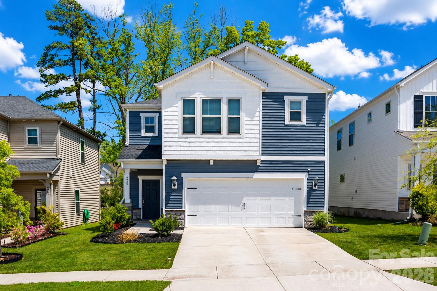 Now offered at an improved price, this better-than-new home in sought-after Larkhaven Hills delivers exceptional value without sacrificing style, space, or convenience. Built in 2021, this move-in-ready 3-bedroom, 2.5-bath home offers over 2,200 square feet of thoughtfully designed living with the open-concept layout, modern finishes, flexible living spaces, and a private wooded backdrop that's hard to find in the neighborhood!

The bright main level is designed for both everyday living and entertaining, featuring a spacious living room, dedicated dining area, and an inviting kitchen with a large island, gas range, walk-in pantry, and abundant cabinetry. Upstairs, the oversized loft offers endless possibilities as a second living area, home office, media room, playroom, or workout space.

The private primary suite features a walk-in closet and en-suite bath, while two additional bedrooms, a full bath, and an upstairs laundry room provide comfort and functionality for everyday life.

Step outside to a fully fenced backyard backing to mature trees for added privacy and a covered patio—perfect for morning coffee, evening dinners, entertaining friends, or letting pets play. A two-car attached garage, generous driveway parking, and low-maintenance exterior make this home as practical as it is inviting.

Located just minutes from I-485, downtown Mint Hill, shopping, dining, and everyday conveniences, Larkhaven Hills offers resort-style amenities including a community pool, clubhouse, playground, sidewalks, and neighborhood green space.

Modern finishes. Flexible living. Private wooded views. An improved price in one of Charlotte's fastest-growing areas. This is the opportunity you've been waiting for!