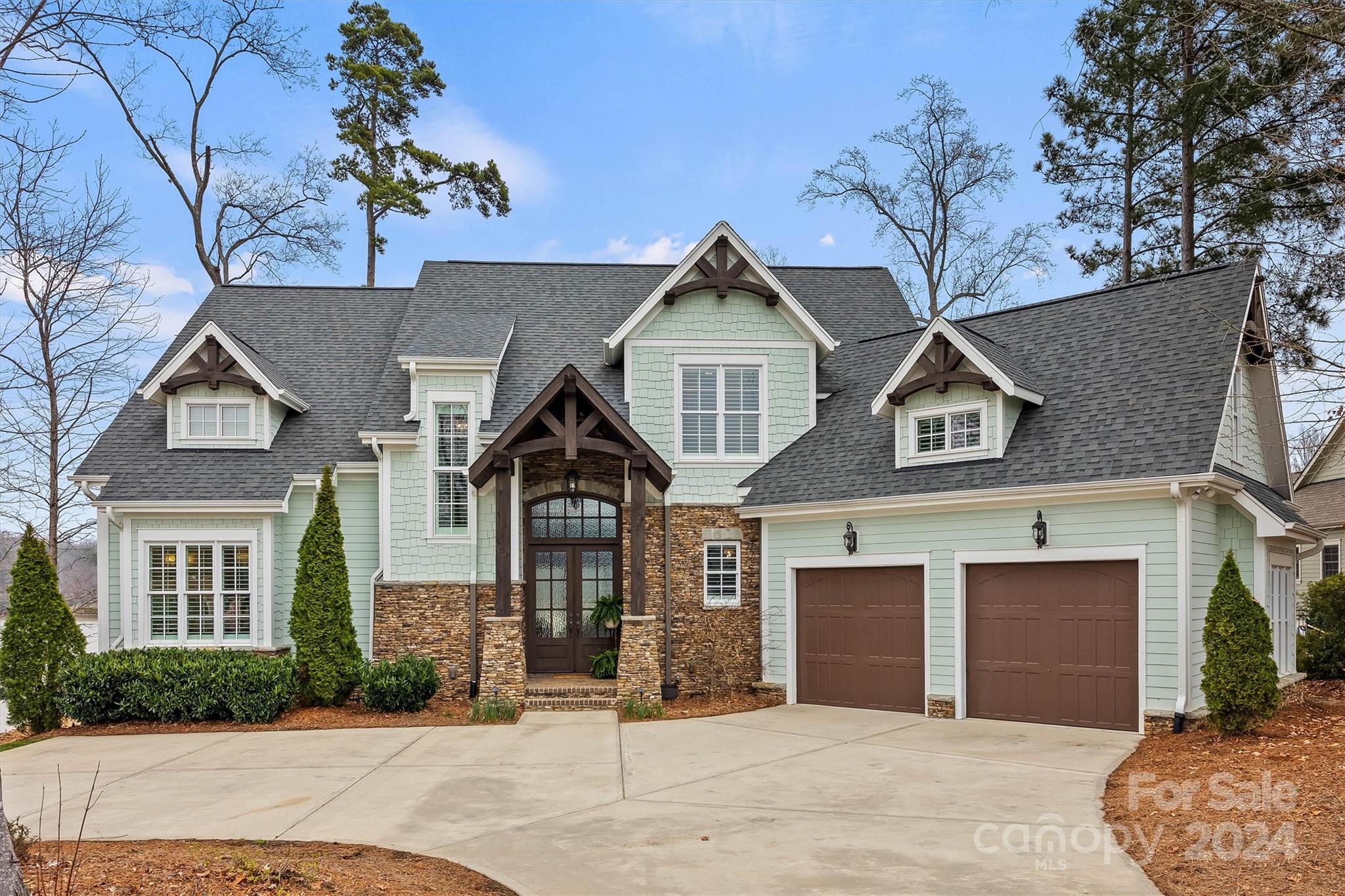 Every day is a vacation in this impeccable home designed for entertaining & luxurious lakeside living. Live outdoors on the stone patio, covered porch w/ fireplace, or spacious yard.  Deep water covered dock w/ boat lift & composite decking. This gem has it all- glorious lake views throughout, rich moldings, hardwood floors, upgrades galore, & open floorplan. Enjoy breathtaking views from your great room w/ coffered ceiling & stone fireplace opening to gourmet kitchen w/ SS appliances, gas cooktop, center island, huge walk-in pantry, & dining room. Incredible main level primary suite offers 2 walk-in closets, & spa-like bath you won’t want to leave. Upper level features 2 BRs w/ private baths, large bonus room, flex room (that could be home office or expanded to add 4th bedroom), & unfinished storage room for possible future expansion. You’ll love the amenity rich Mclean community & beautiful Belmont, with a small-town feel, but oh-so convenient to Uptown Charlotte, I-85, & airport.