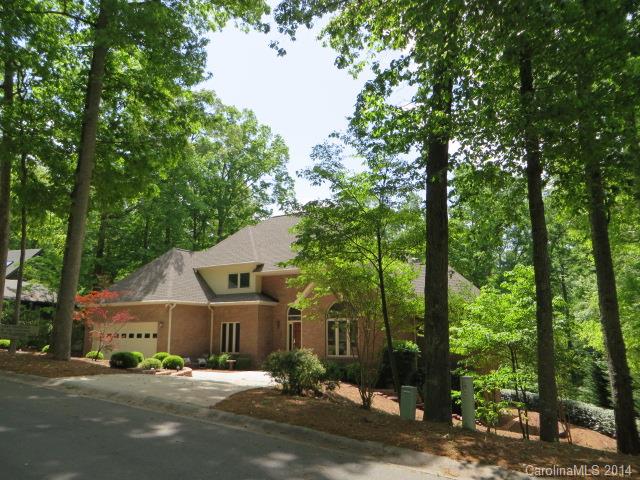Beautiful FULL BRICK home w/walk-out basement,covered patio, screened porch & deck. Dramatic 2 story Foyer & GR w/vaulted ceilings, skylights,media center & wall of windows w/wooded views. 2 sided fireplace to Kitchen/Brk area w/HWs,wet bar. Formal DR. Office w/French doors. 1st floor Master has spa-like bath w/corner Jacuzzi tub, frameless glass shower & double sink vanity w/gorgeous cabinetry.