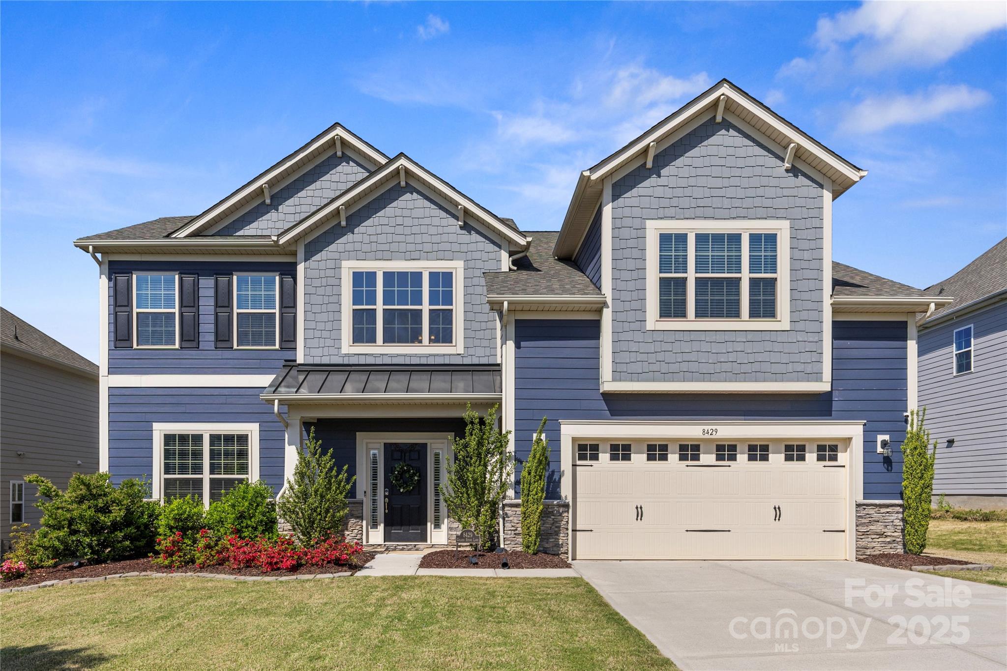 Located within minutes of all Ballantyne has to offer just across the South Carolina border in Fort Mill, 8429 Golden Stone Lane is a beautiful, move-in ready home you don't want to miss! This two story home features 5 bedrooms (main floor room currently used as a home office), 3 full & 1 half bathrooms, 3,332 sq ft, incredible indoor outdoor living with screen porch, outdoor fire pit, fenced back yard with beautiful landscaping. Kitchen features stainless steel appliances, large kitchen island w/ seating, farmhouse sink, granite countertops, walk-in pantry, kitchen dining area & overlooks the great room w/ gas fireplace. Primary suite is oversized w/ double vanity, large shower & walk-in closet. Secondary bedrooms are spacious & private. Large laundry room located on upper level w/ side-by-side washer/dryer. When you enter from two car garage, spacious drop zone & oversized closet for storage. The Covington community features clubhouse, pool, playground & sidewalks. A must see home!
