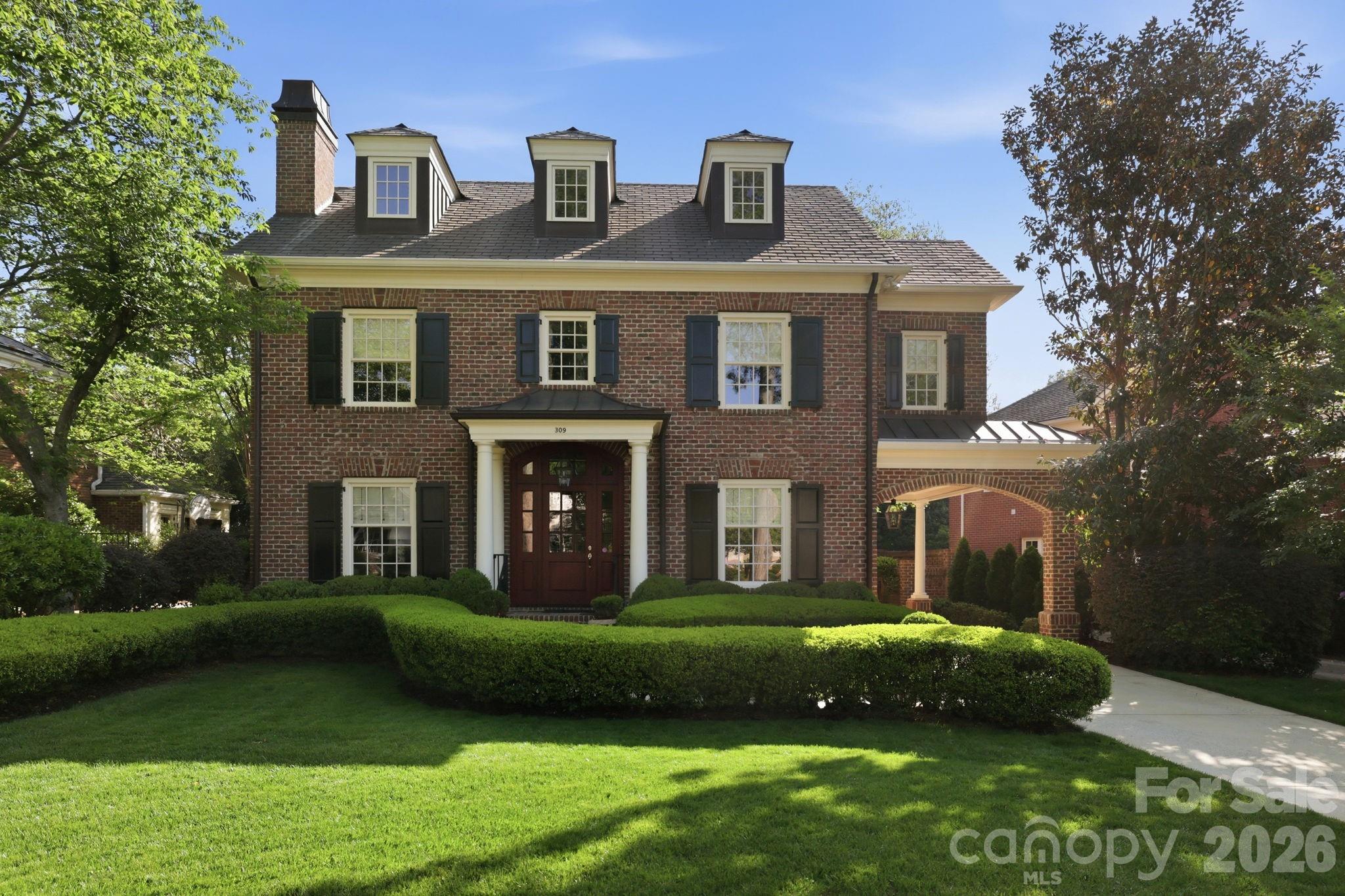 Set on one of the most desirable streets in Eastover, this beautifully maintained one-owner brick home finished in 2008 offers timeless architecture, a traditional floorplan, and exceptional livability in one of Charlotte’s most established neighborhoods.
With 9-foot ceilings on both the first and second levels and 8-foot ceilings on the third, the home feels open, balanced, and thoughtfully scaled throughout. Solid wood doors and classic architectural details reflect the quality and craftsmanship that define the property.
The main level is designed for both everyday living and entertaining, offering generous living spaces anchored by two wood-burning fireplaces—each currently equipped with gas logs. The traditional layout provides a natural flow, with well-defined rooms that still feel connected and inviting.
Upstairs, the primary suite is privately situated alongside two additional bedrooms, creating an ideal configuration for daily living. The third level offers even more flexibility with a fourth bedroom, bonus room, and a large stand-up walk-in attic, along with two additional walk-in attic spaces—providing exceptional storage.
Outdoor living is equally compelling, featuring a private backyard enclosed by a brick wall and surrounded by mature evergreens, along with a rear porch showcasing a beautiful cypress ceiling. A welcoming front stoop and covered portico complete the home’s classic curb appeal.
A rare opportunity to own a thoughtfully designed, one-owner home on a premier street in Eastover, offering timeless appeal, privacy, and enduring quality.