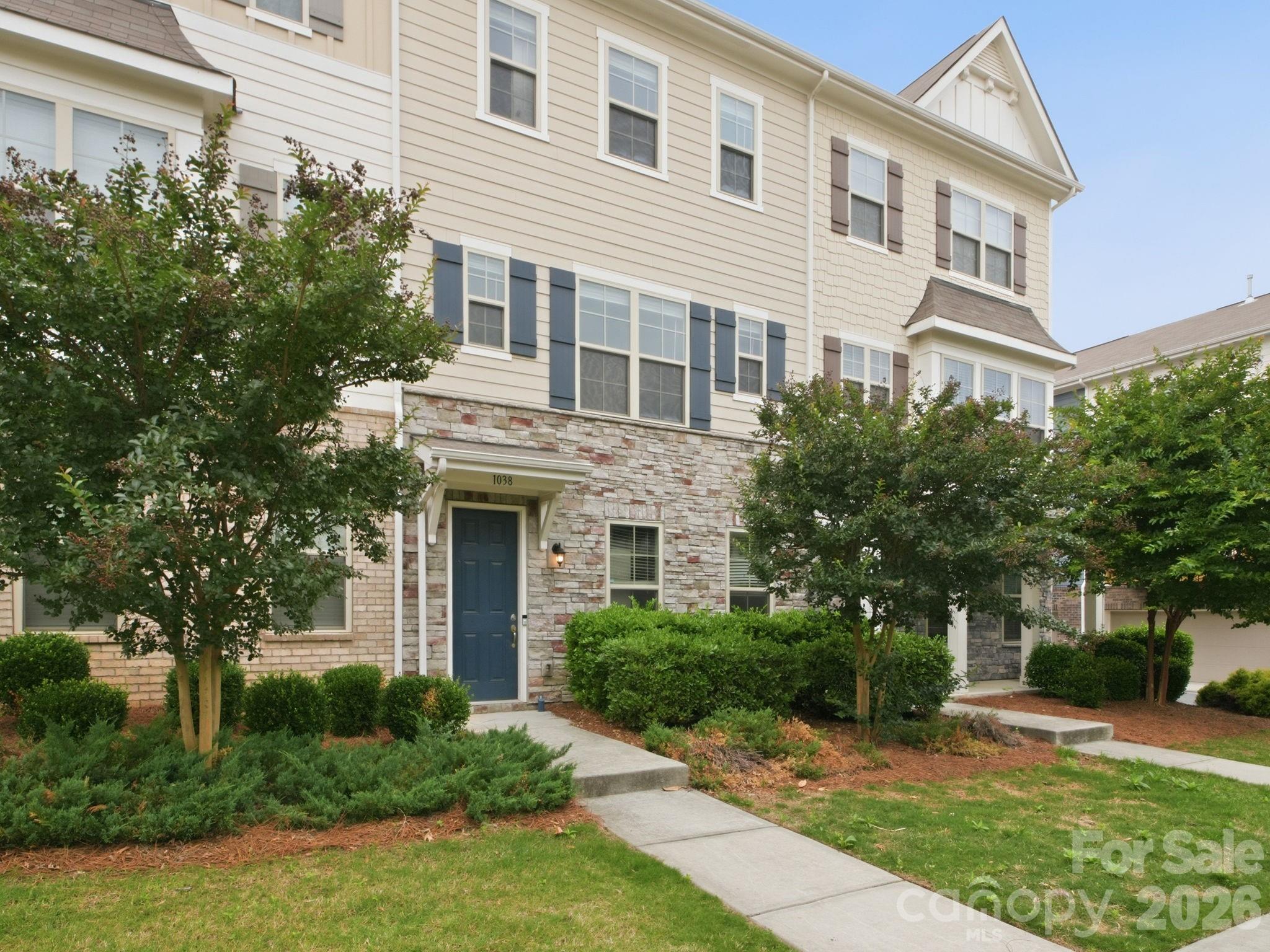 This is the kind of home that makes life feel easy. Located just around the corner from the light rail, this stylish 3-story townhome blends convenience, comfort, and low-maintenance living in all the right ways.
The entry level features a private guest suite with a full ensuite bath—perfect for visitors, a home gym, media room, or tucked-away flex space. The 2-car garage is equipped with a 240-volt charger, adding modern convenience right at home.

Upstairs, the open-concept main living area was made for gathering. The spacious kitchen features a huge island that flows seamlessly into the dining and living spaces, creating an ideal setup for entertaining, cozy nights in, or hosting game day with friends. Step out onto the balcony for morning coffee or an evening unwind.

The top floor offers three bedrooms, including a spacious primary suite and versatile secondary rooms that work beautifully as bedrooms, an office, nursery, or creative space. Brand new vinyl flooring throughout the main living spaces gives the home a fresh, updated feel.

Move-in ready with thoughtful spaces and an unbeatable location close to shopping, dining, and transit—this townhome is ready for its next chapter!
