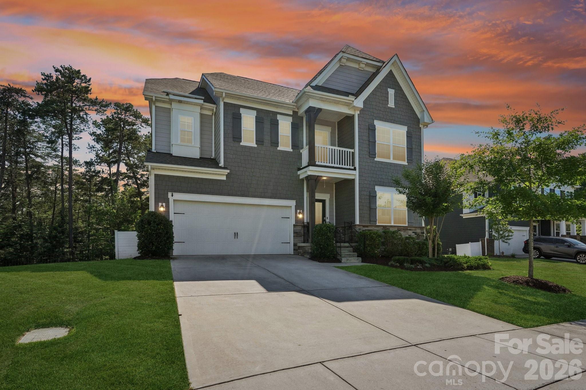 Welcome to The Palisades, one of Charlotte's premier resort-style communities. This stunning 6-bedroom, 5-bath home offers the perfect blend of luxury, space, and lifestyle, featuring lake access, breathtaking water views, and an incredible fully finished walk-out basement that lives like a second home.

The open-concept design showcases a spacious chef's kitchen overlooking the dining area and expansive family room with a fireplace, creating the ideal setting for entertaining and everyday living. A main-level guest suite provides privacy and convenience for visitors or multi-generational living.

Upstairs, retreat to the luxurious owner's suite featuring a spa-inspired bath and dual walk-in closets. Three additional bedrooms, two full baths, and a convenient laundry room complete the upper level.

The real showstopper is the fully finished walk-out basement, featuring an additional kitchen, full bathroom, laundry area, bedroom, and living space—perfect for guests, extended family, an in-law suite, or endless entertainment possibilities.

Step outside to the oversized screened porch and enjoy peaceful lake views year-round. With direct access to the water, this property offers the rare opportunity to enjoy true lakefront living while benefiting from all the amenities The Palisades has to offer.

Residents enjoy access to the private Residents Club, featuring resort-style pools, a fitness center, sports courts, playgrounds, social activities, and more.

If you've been searching for a home that offers luxury, flexibility, breathtaking views, and an unmatched lifestyle, this is the one you've been waiting for.
