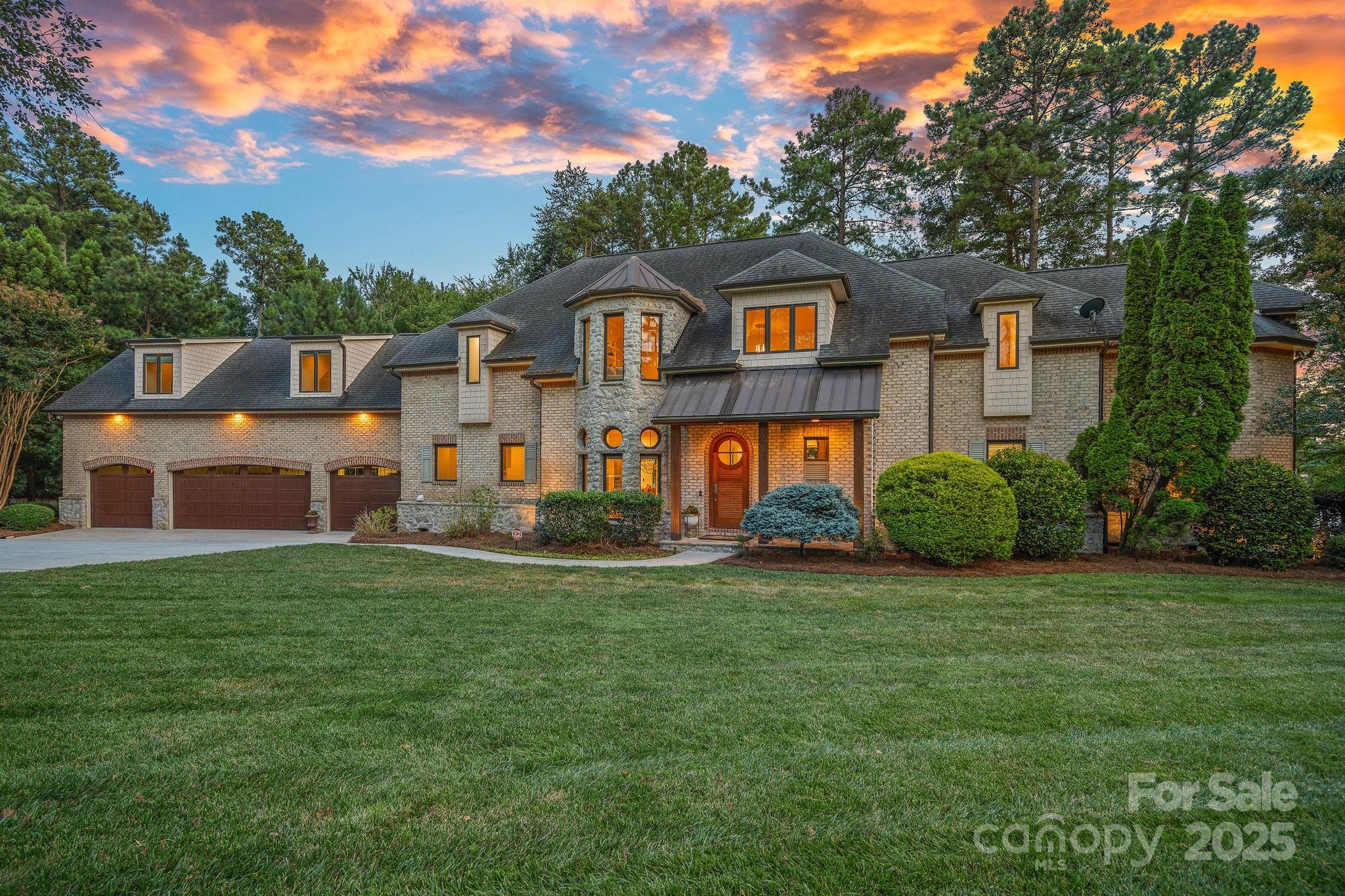 Stunning lakefront home with 300 feet of sandy beach shoreline and expansive open water views from every room. This stylishly updated property offers 5 bedrooms, a large bonus room, and a bright, open layout designed for effortless living and entertaining. The designer kitchen is a showstopper, boasting top-of-the-line finishes including a Wolf cooktop, Sub-Zero fridge, and an impressive island. The spa-inspired primary bath and all additional bathrooms have been recently renovated with high-end finishes. Embrace a healthy, rejuvenating lifestyle with your own private sauna, hot tub, cold plunge, and outdoor shower—perfect for relaxation and wellness year-round. This is lake living at its finest—luxury, comfort, and views that never end.