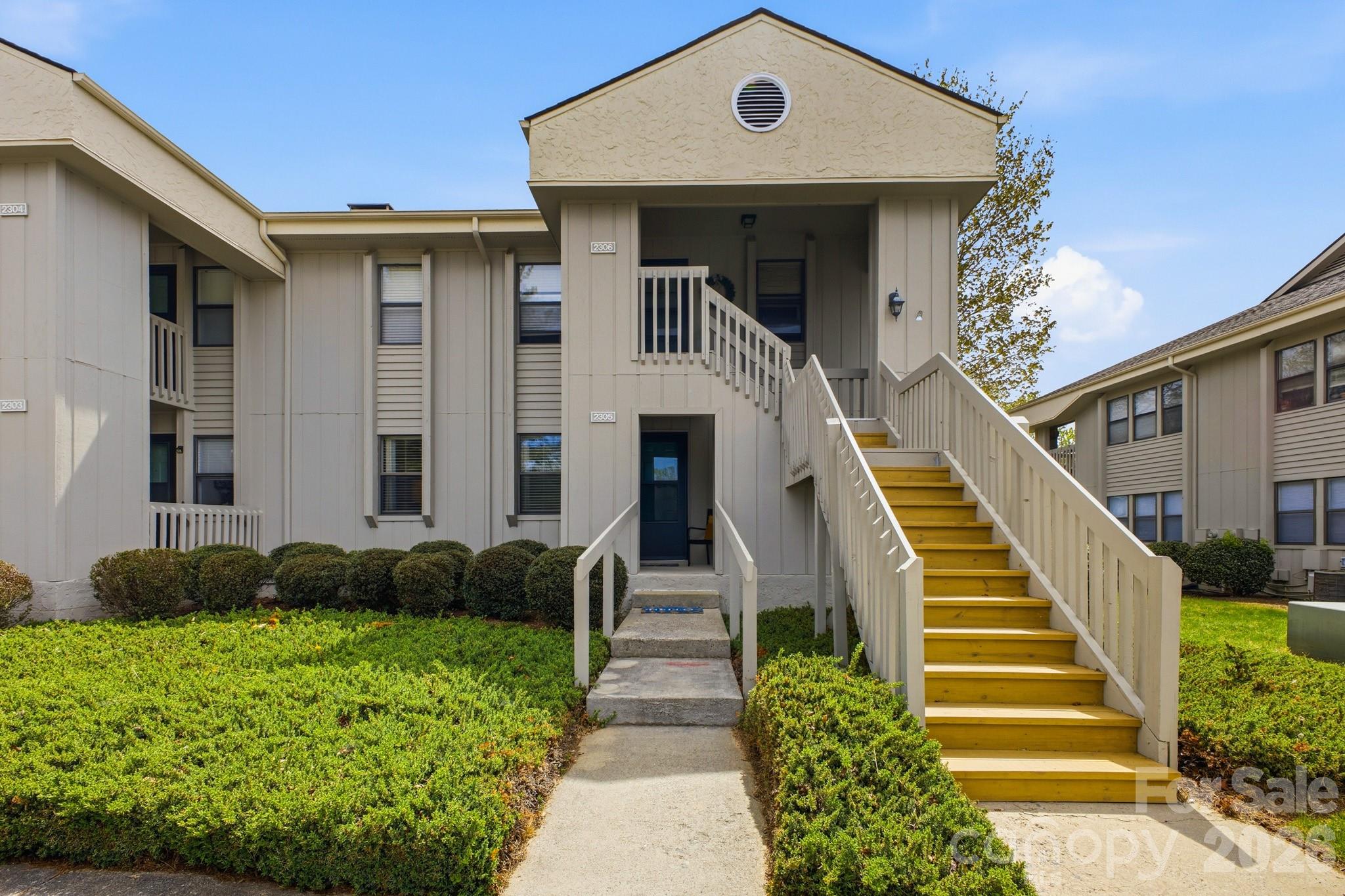 This highly coveted lower-level end unit in the Cloisters community has been thoughtfully updated and awaits your personal touch. Located in one of the most convenient areas of Asheville, yet tucked away in a tranquil setting, this community offers both convenience and natural surroundings. The over-sized primary suite overlooks a private green space, with double closets and an updated bath. The secondary bedroom has direct access to a full bath and provides ample space for guests or a home office. The fully enclosed sunroom can be used as a reading space, home gym or office. The renovated kitchen has added storage and provides the perfect backdrop for your next culinary masterpiece. The community also offers tennis courts, a large outdoor pool, clubhouse and fitness facilities, mere steps from the condo.