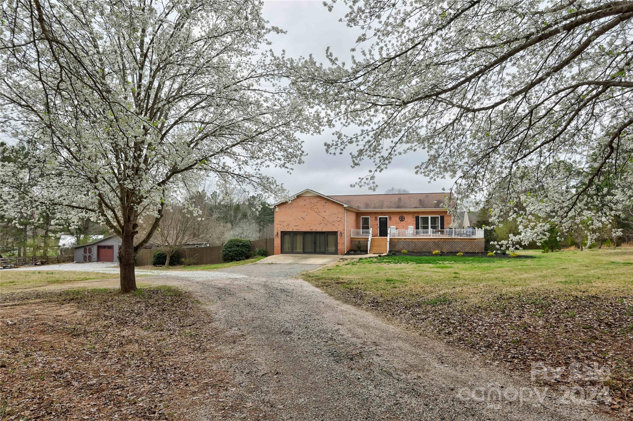 Discover your ultimate retreat on 5 sprawling acres of tranquility on a quiet cul-de-sac. This captivating ranch-style home boasts a finished basement, offering ample space for relaxation and entertainment. Embrace the convenience of a 3-car garage with workshop area perfect for tinkering on projects. Workshop has AC/Dehumidifier and garage has smart garage door openers. Step outside to your private oasis, complete with a refreshing in ground cement (PebbleTec) pool and a screened-in porch, offering the perfect spot for relaxation. Home has a top of the line water filtration system. The updated kitchen awaits your culinary adventures, while a tranquil pond in the back enhances the picturesque setting. Embrace the rural charm of  this property as horses are welcomed, providing a haven for equestrian enthusiasts. Plus, ample parking space ensures your RV finds a home too. Experience the perfect blend of comfort and adventure in this idyllic haven.