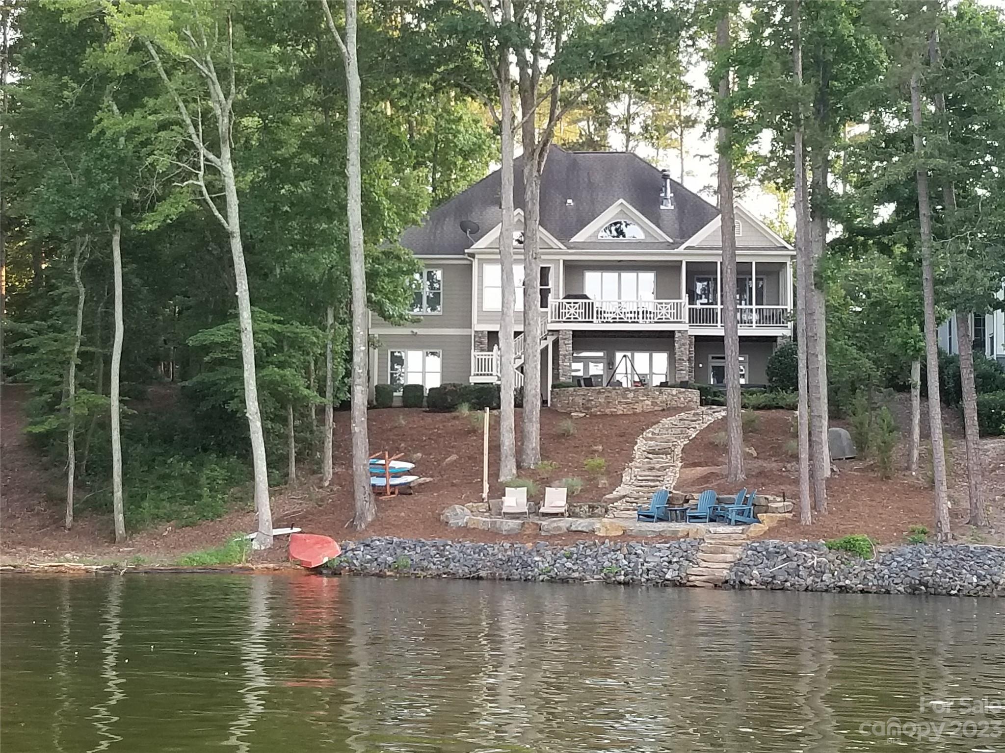 This magnificent Badin Lake waterfront home is located in the prestigious golf community of Uwharrie Point. A stately 5 bedroom, 4 full bathroom home with unrivaled views overlooking the Main Channel. Excellent layout; split bedroom floor plan. Enjoy your coffee in the breakfast area off kitchen, front deck off living room, or screened porch off master. 10' ceilings on main level. Great room w/vaulted ceilings. Master & laundry on main. Master en suite features his & hers vanities, 2 walk-in closets & heated bathroom floors. Laundry on main (off garage). Upper/bonus room currently being used as 6th bedroom. Walk-in attic. 2-car garage. Lower level includes 2nd master en suite, billiards, living room w/fireplace & 2 spacious storage rooms. Outdoor fire pit area. Beautifully landscaped. The community is complete with 24 hour security, highly rated golf course, marina, clubhouse, restaurant, pool, tennis courts & more. Club opportunities require membership. 1 hour from Charlotte or Triad.
