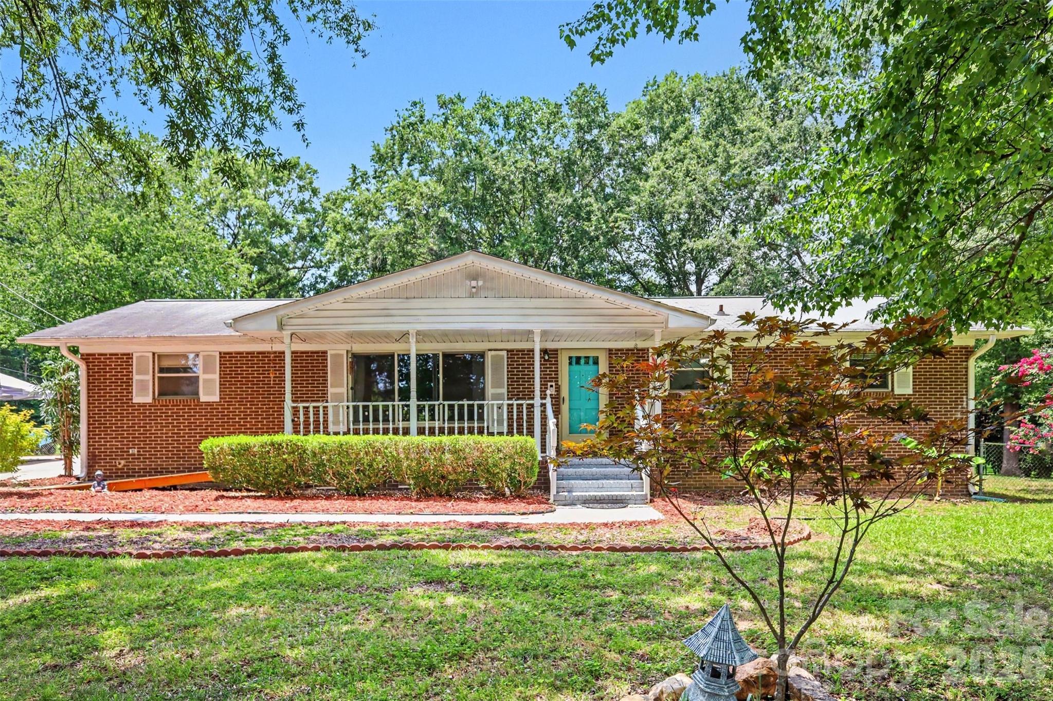 Welcome to this charming 3-bedroom, 2-bath brick ranch situated on a beautiful 1-acre lot in one of Rock Hill's most desirable areas. This well-maintained home offers a spacious and inviting layout with a bright kitchen featuring a center island, breakfast bar, stainless steel appliances, and plenty of cabinet space. The large sunroom is perfect for relaxing or entertaining year-round. The primary suite includes a private bath with dual vanities. Step outside to a spacious backyard with a deck overlooking the above-ground pool (currently empty), offering the opportunity to create your own outdoor retreat. With no HOA, ample room to enjoy the outdoors, and a prime location close to shopping, dining, schools, and major highways, this property combines privacy. space and convenience. Don't miss this rare opportunity!