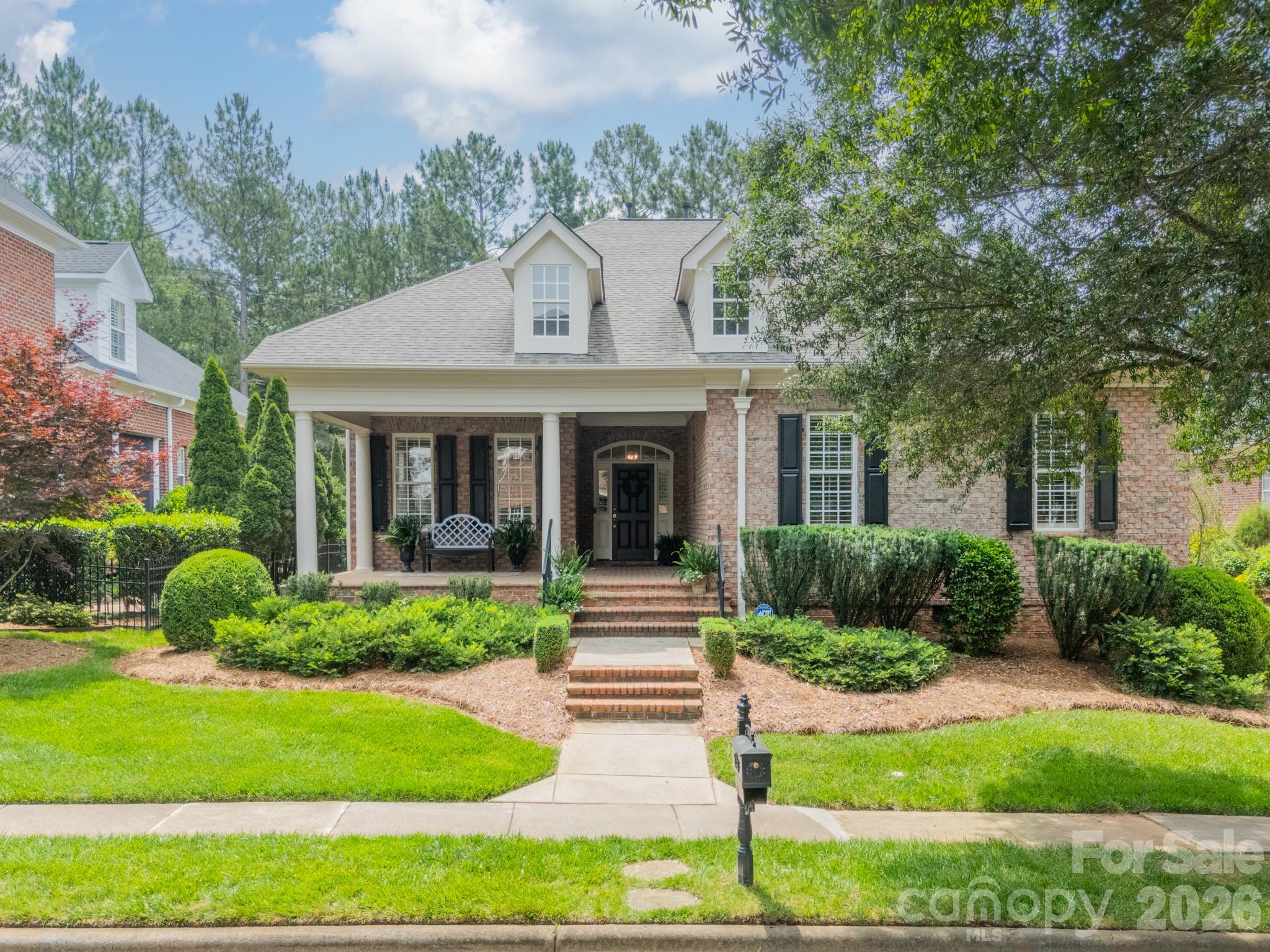 Welcome to 14806 Ballantyne Glen Way, a stunning single-family detached home offering 2,834 square feet of thoughtfully designed living space set in the Traditions at Ballantyne Country Club. An expansive front porch welcomes you to this beautiful home made for easy living! Enter the home to find spectacular millwork, high ceilings, 8 ft. doors on the main level, and hardwood flooring. Primary suite on main, along with two other bedrooms, makes this home perfect for first-floor living. Formal dining room as well as an eat-in kitchen featuring double ovens, gas cooktop, and huge walk-in pantry are an entertainer's dream. Great room with a beautiful tray ceiling opens up onto a lovely back porch and patio with lush landscaping, perfect for relaxing private nights! Upstairs, you will find an additional bedroom/bonus room with a full bathroom and HUGE walk-in attic space perfect for all your storage needs. Additional highlights include a large dedicated laundry room. Don’t miss this opportunity to own a move-in-ready home offering both comfort and style. 

Community amenities include walking trails, sport court, playgrounds, and dog park. Other amenities listed require club membership. Membership is optional, not mandatory.