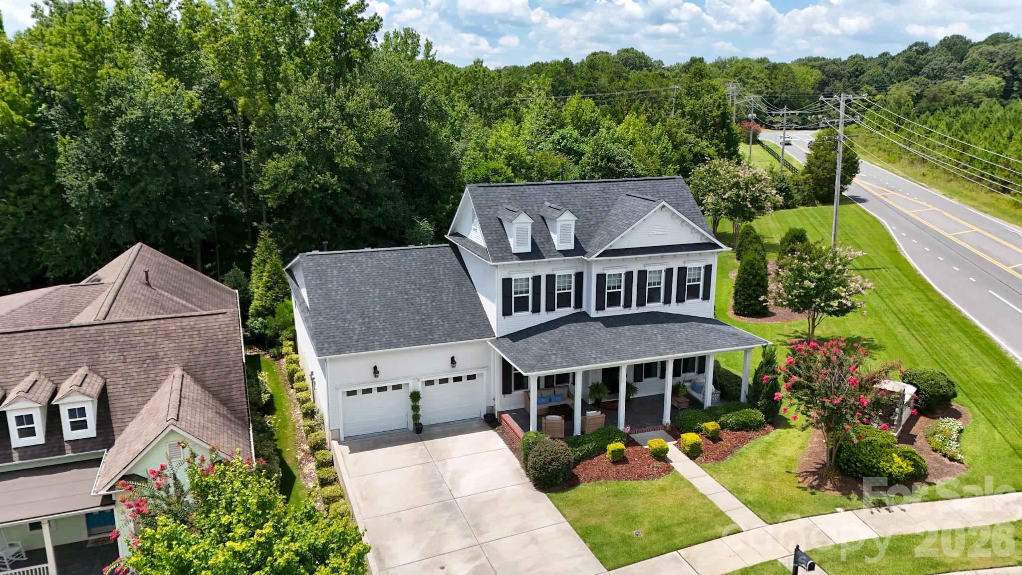 Located in the highly sought-after Cureton community and zoned for top-rated Cuthbertson schools, this custom-built home by Cunnane Builders offers exceptional craftsmanship, timeless design, and comfortable everyday living. Filled with natural light and quality finishes throughout, the thoughtfully designed floor plan features an oversized primary suite and private guest bedroom on the main level, providing the convenience and flexibility today's buyers desire.

The gourmet kitchen serves as the heart of the home, showcasing custom cabinetry, a large center island, commercial-grade faucet, and a 6-burner gas cooktop with vented stainless-steel hood. Open to the dining area and spacious great room, the layout is ideal for both entertaining and everyday living. A dedicated office just off the foyer provides a private workspace, while upstairs you'll find two additional bedrooms and a generous loft/flex space perfect for a media room, playroom, home office, or second living area.

The luxurious main-level primary retreat offers a peaceful escape with a spa-inspired bath featuring dual vanities, a soaking tub, walk-in shower, and generous closet space. A separate main-level guest suite provides privacy and comfort for visitors or multi-generational living.

Step outside to your own private retreat featuring a screened porch, stamped concrete patio, custom brick fireplace, and fully fenced backyard. Positioned on a premium corner homesite, the property benefits from a generous side yard, mature landscaping, and added separation from neighboring homes, creating a sense of openness rarely found within the community. The thoughtfully designed outdoor living spaces offer the perfect setting for relaxing, entertaining, and enjoying the outdoors year-round.

Positioned on one of Cureton's most unique homesites, the property enjoys open views, abundant natural light, and exceptional separation from neighboring homes. With common area and open space surrounding multiple sides of the property, the homesite offers a sense of openness and privacy rarely found in a neighborhood setting.

Beautifully maintained and move-in ready, this exceptional home combines luxury, warmth, and functionality in one of Waxhaw's most desirable neighborhoods. Residents of Cureton enjoy resort-style amenities including a clubhouse, outdoor pool, playground, and walking trails, all conveniently located near shopping, dining, and historic downtown Waxhaw.