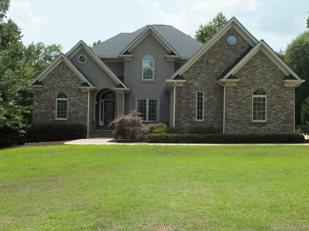 Beautiful all brick home in Meadow Lakes II! Open concept with master on main. 3 beds up, 3.5 baths, bonus room, office and computer room.  Kitchen w/ granite &  SS appliances. Tall ceilings and hardwood floors on main. Full walk out basement. Huge 2+ acre private back yard with par 3 golf range and half basketball court. Large deck.  Walking distance to Northwestern High School and Rawlinson Road middle school.  Neighborhood amenities include pool, tennis courts, club house and lakes.