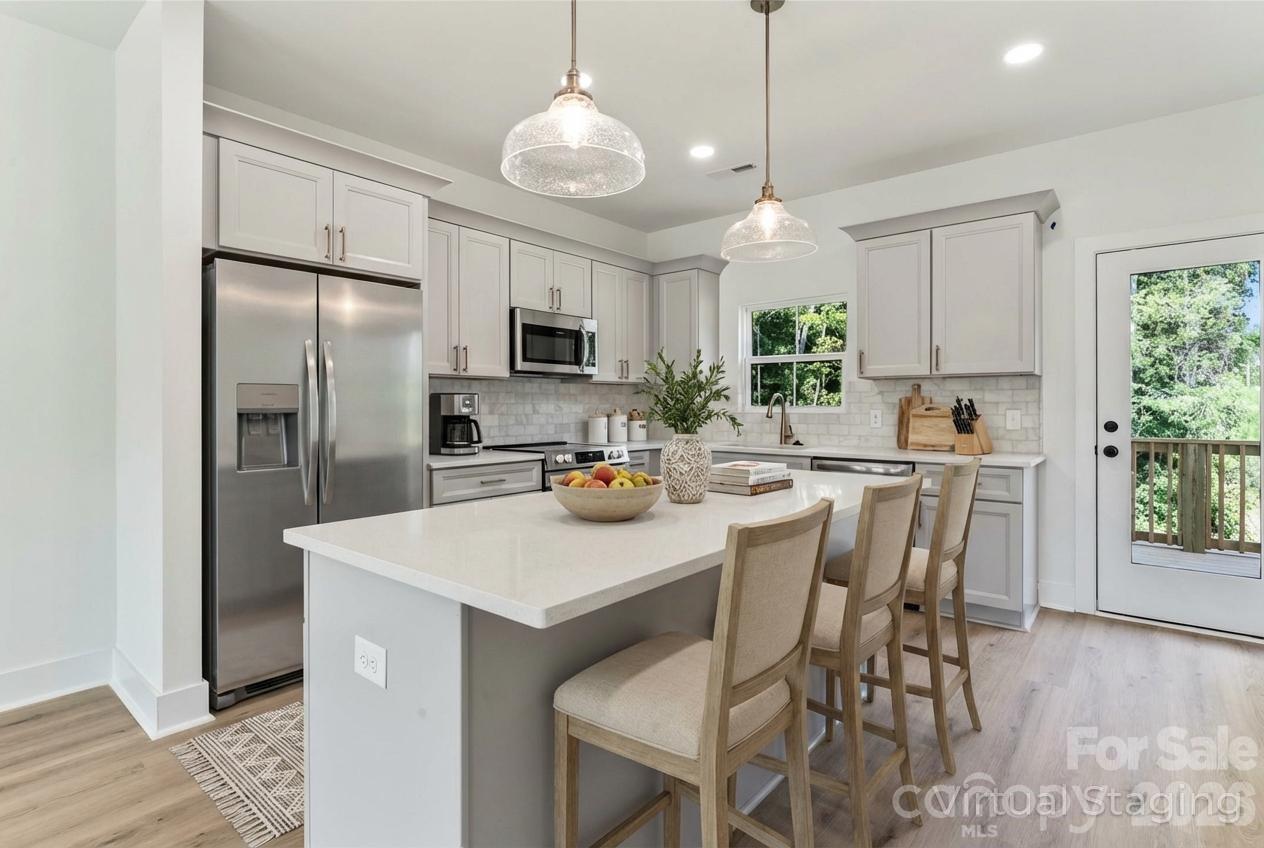 New Construction Town Home. Welcome to Aberdeen at Wilson Farms! Located in Fort Mill High School District! Nestled in one of Fort Mill's premier neighborhoods, enjoy the ease of living near top-tier grocery stores and esteemed schools. A beautifully designed 3 story living space offering over 1900 Sq Ft per unit and two car garage. This expansive residence features 3 spacious bedrooms and 2 full bathrooms, plus 1 convenient half bathroom per unit. The heart of the home is the modern kitchen, equipped with top-of-the-line stainless steel appliances that make cooking a delight. Qualifying homes come with a 1 Year Craftsmanship Warranty and 10 Year Structural Warranty. HOA fees include master insurance policy and exterior maintenance!
